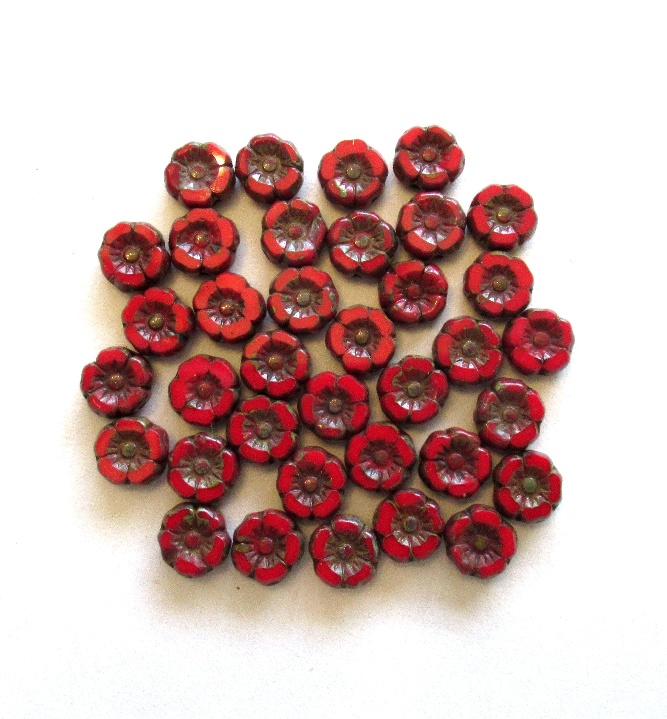 Twelve small 7mm Czech glass flower beads - opaque red w/ picasso accents - table cut carved Hawaiian hibiscus flower beads C00911