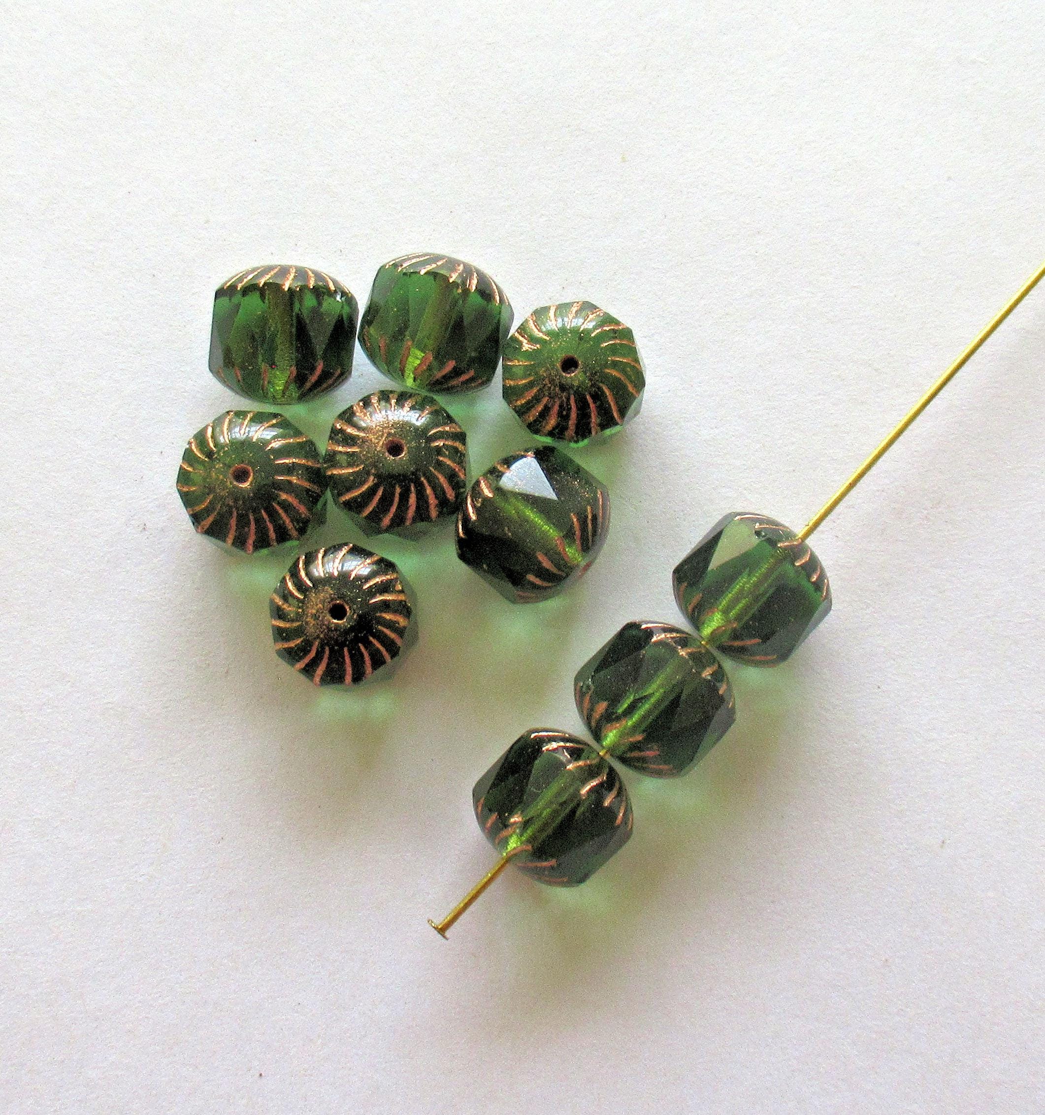 Ten large Czech glass center faceted carved cruller beads - 10mm - round transparent emerald green cathedral beads w/ copper accents - 00063