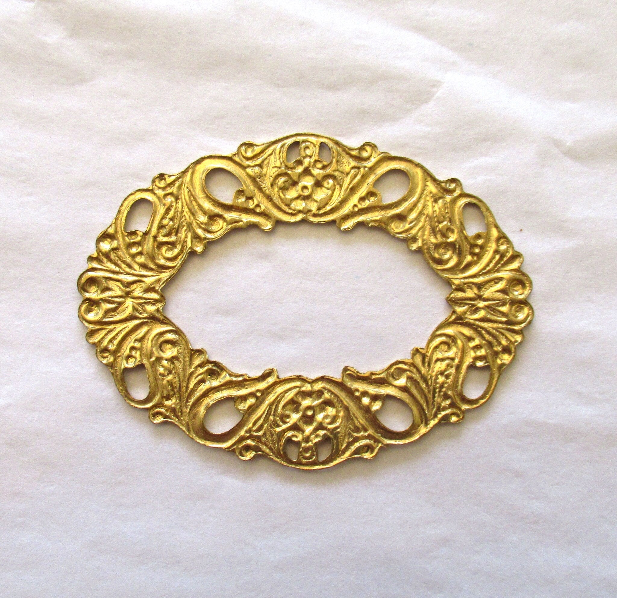 1 raw brass stamping - ornate oval wreath - connector ring - ornament - 55 x 42 mm - made in the USA C0078