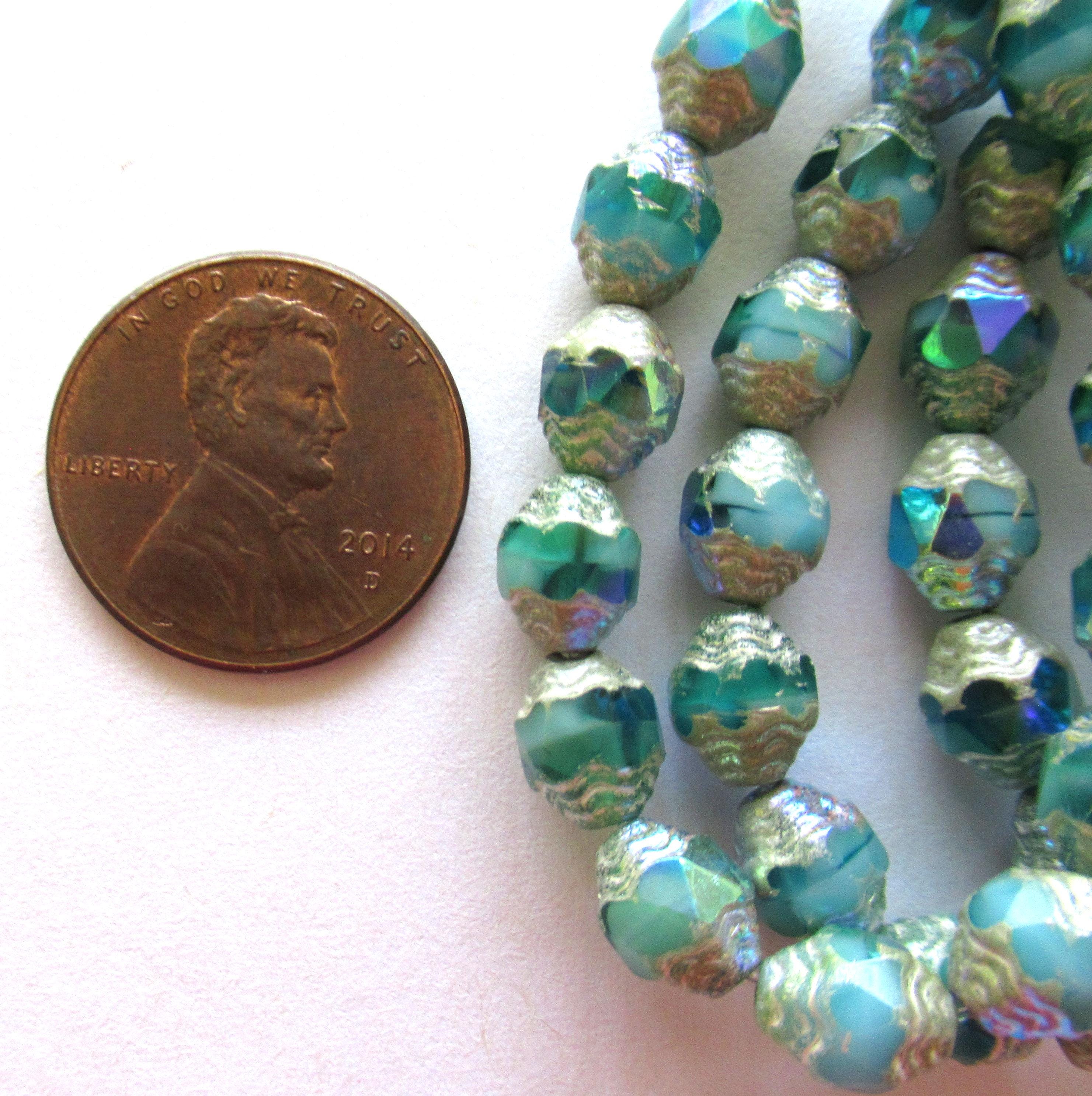 15 Czech glass mini antique style faceted carved oval cathedral beads - 8 x 6mm - opaque & transparent blue green ab w/ silver accents - C000572