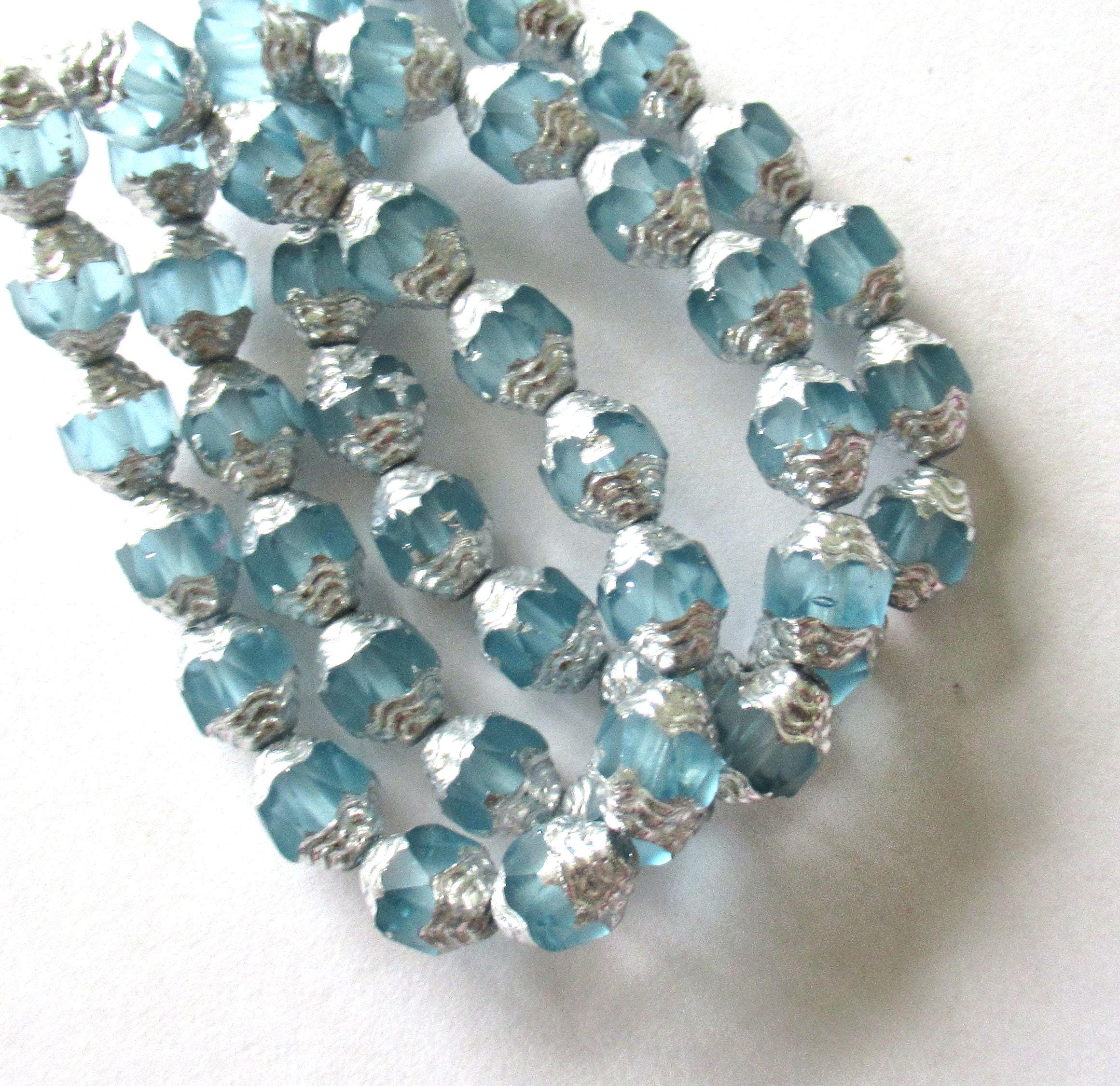 15 Czech glass mini antique style faceted oval cathedral beads - 8 x 6mm matte ice blue with silver accents - C00071