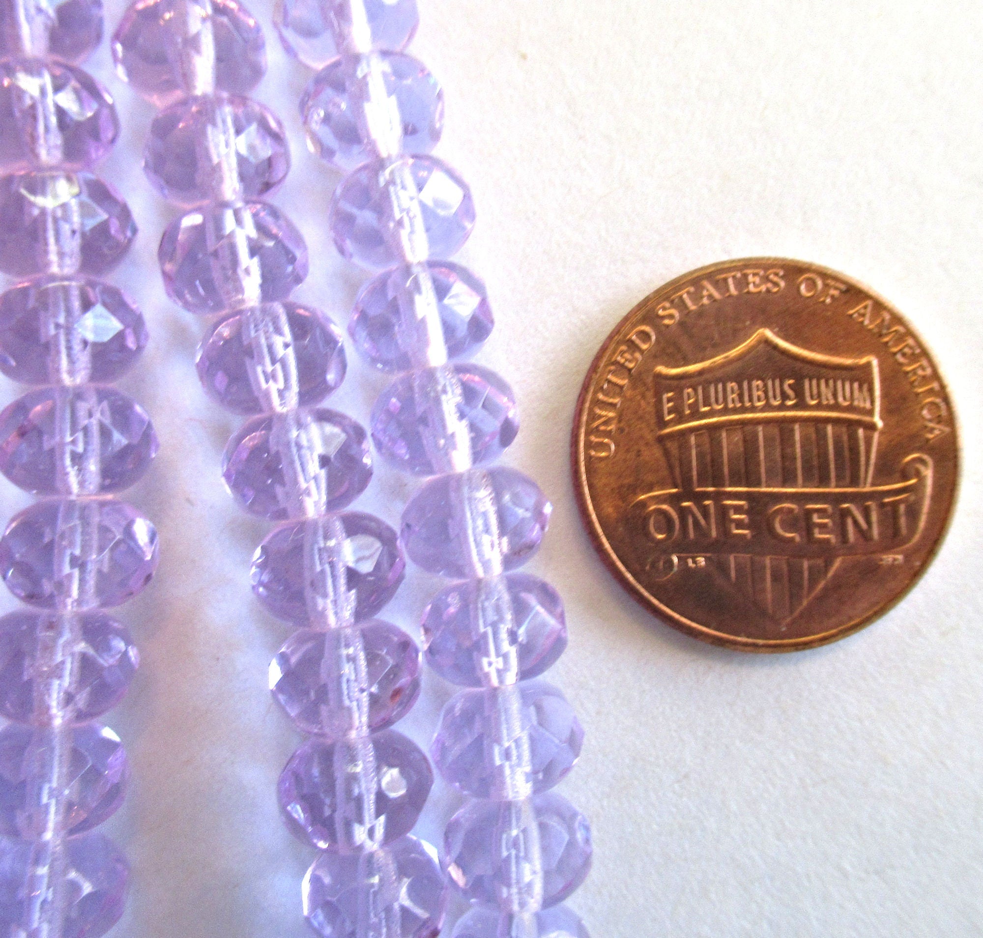 Lot of 25 faceted puffy rondelle or donut beads - 5 x 7mm transparent alexandrite or lavender beads - C0055