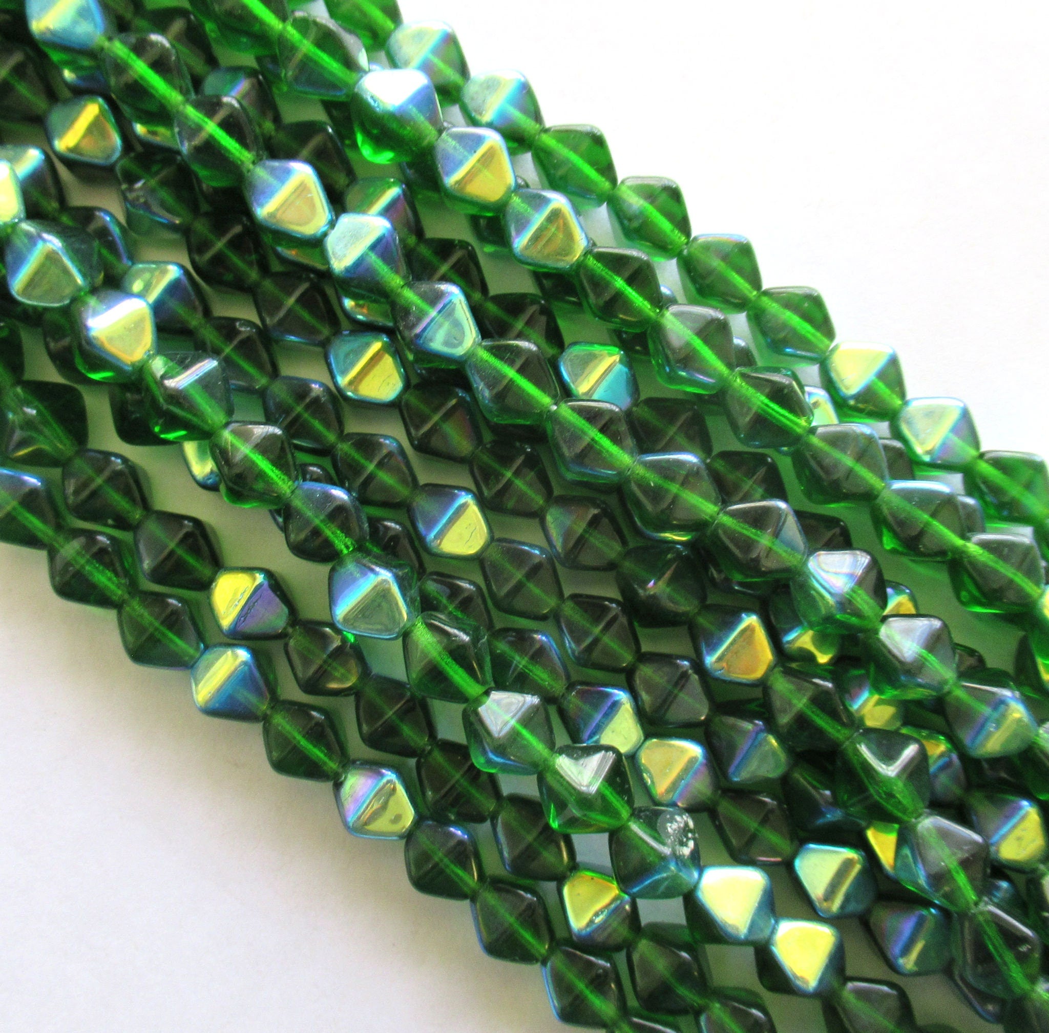 Twenty-five 8mm Czech glass bicone beads - Emerald Green AB pressed glass bicones - C0063