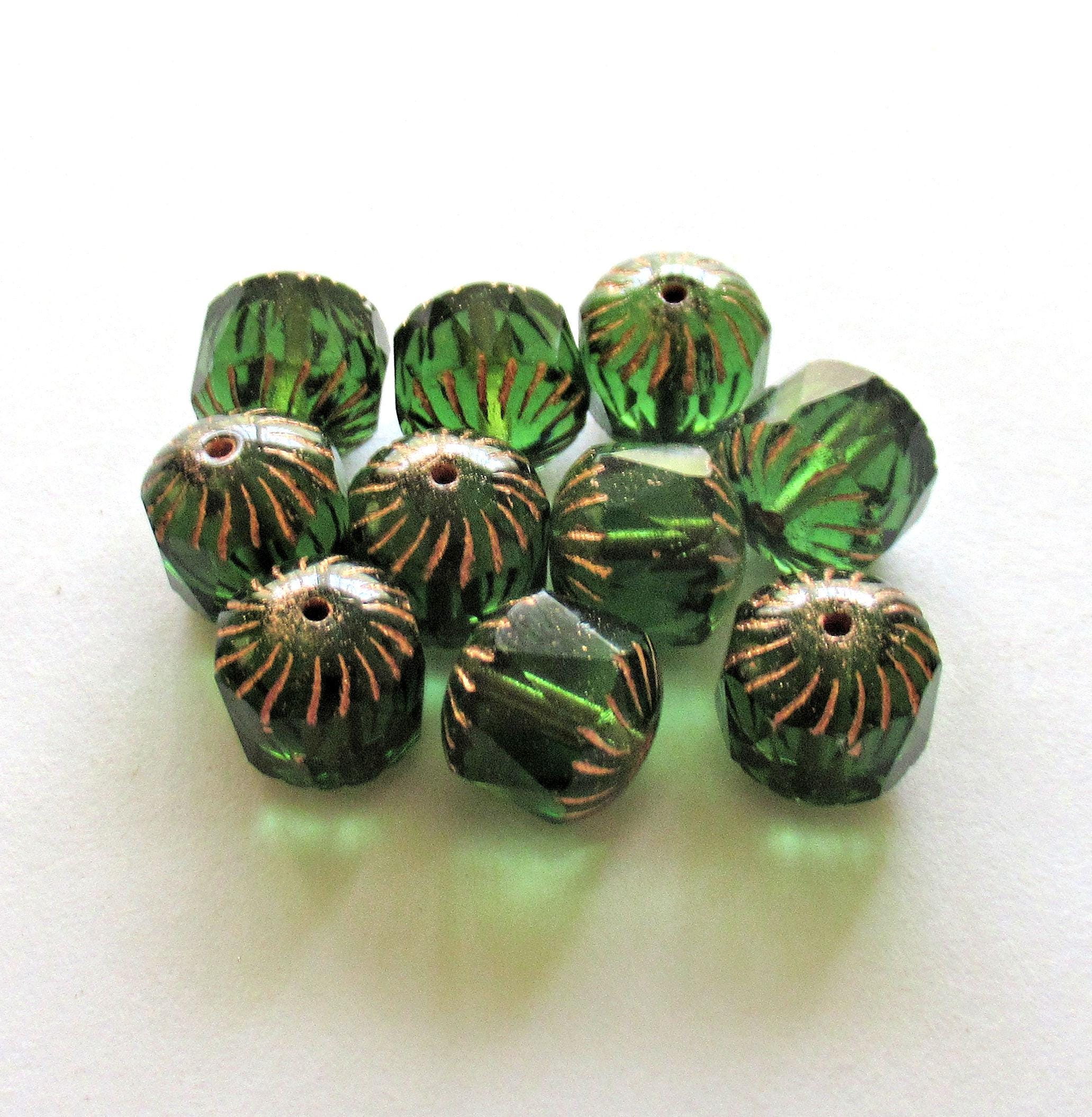 Ten large Czech glass center faceted carved cruller beads - 10mm - round transparent emerald green cathedral beads w/ copper accents - 00063