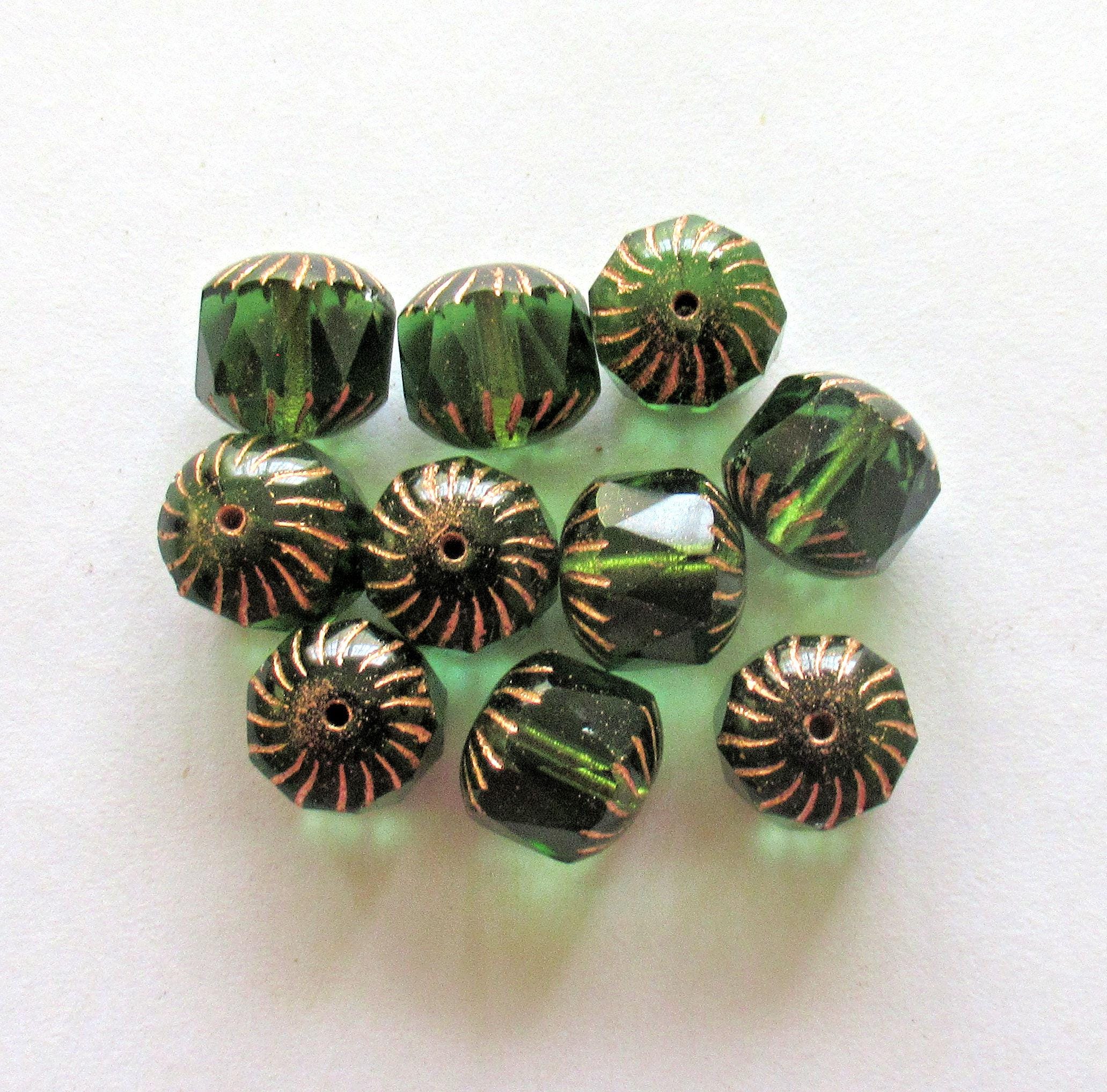 Ten large Czech glass center faceted carved cruller beads - 10mm - round transparent emerald green cathedral beads w/ copper accents - 00063