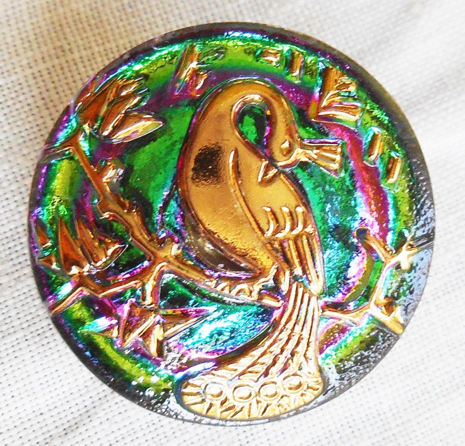 One 22mm Czech translucent green and gold glass peacock button with pink accents, decorative shank buttons C05201