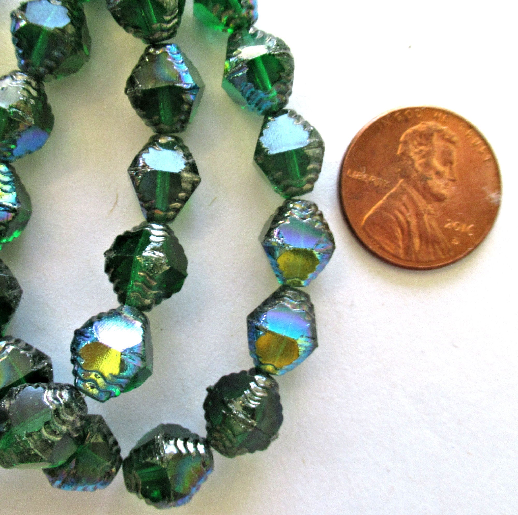 Fifteen Czech glass bicones - 10 x 8mm emerald green ab w/ silver accents - table cut carved notched bicone beads - C00362