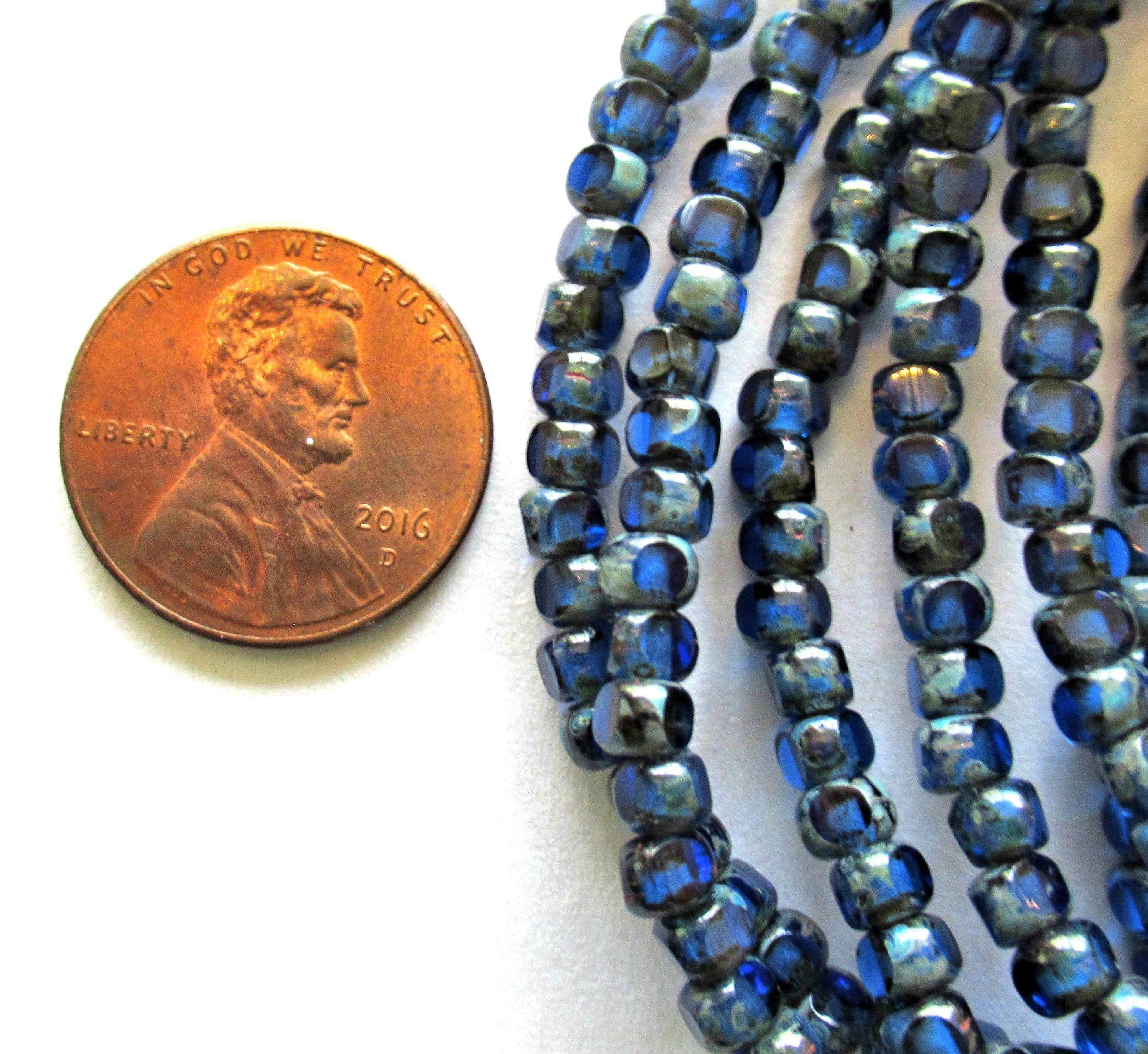 50 Czech glass 6/0 faceted seed beads - transparent sapphire blue with picasso accents - 3 cut - tri-cut - 4 x 3mm beads - C00041