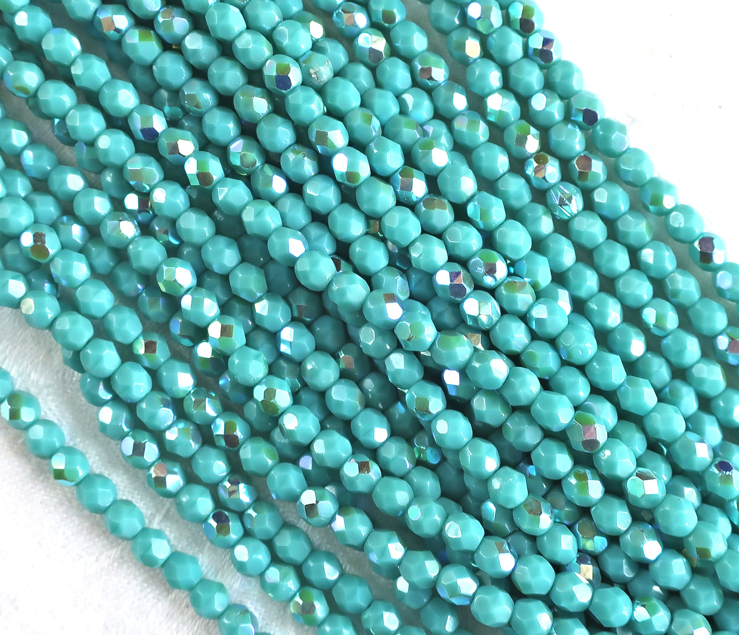 Lot of 50 4mm opaque Turquoise AB Czech glass beads, firepolished, faceted round beads, C9601 - Glorious Glass Beads