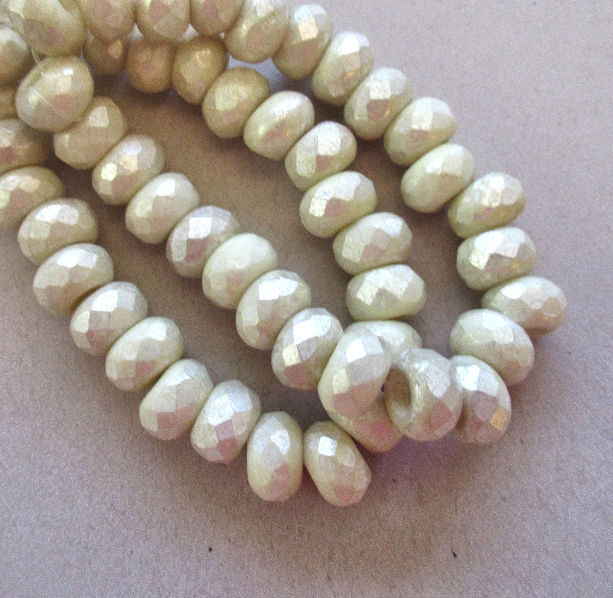 Ten Czech glass roller beads - 6 x 9mm off white or ecru w/ a silvery mercury finish faceted roller, rondelle, big 3.5mm hole beads C0099