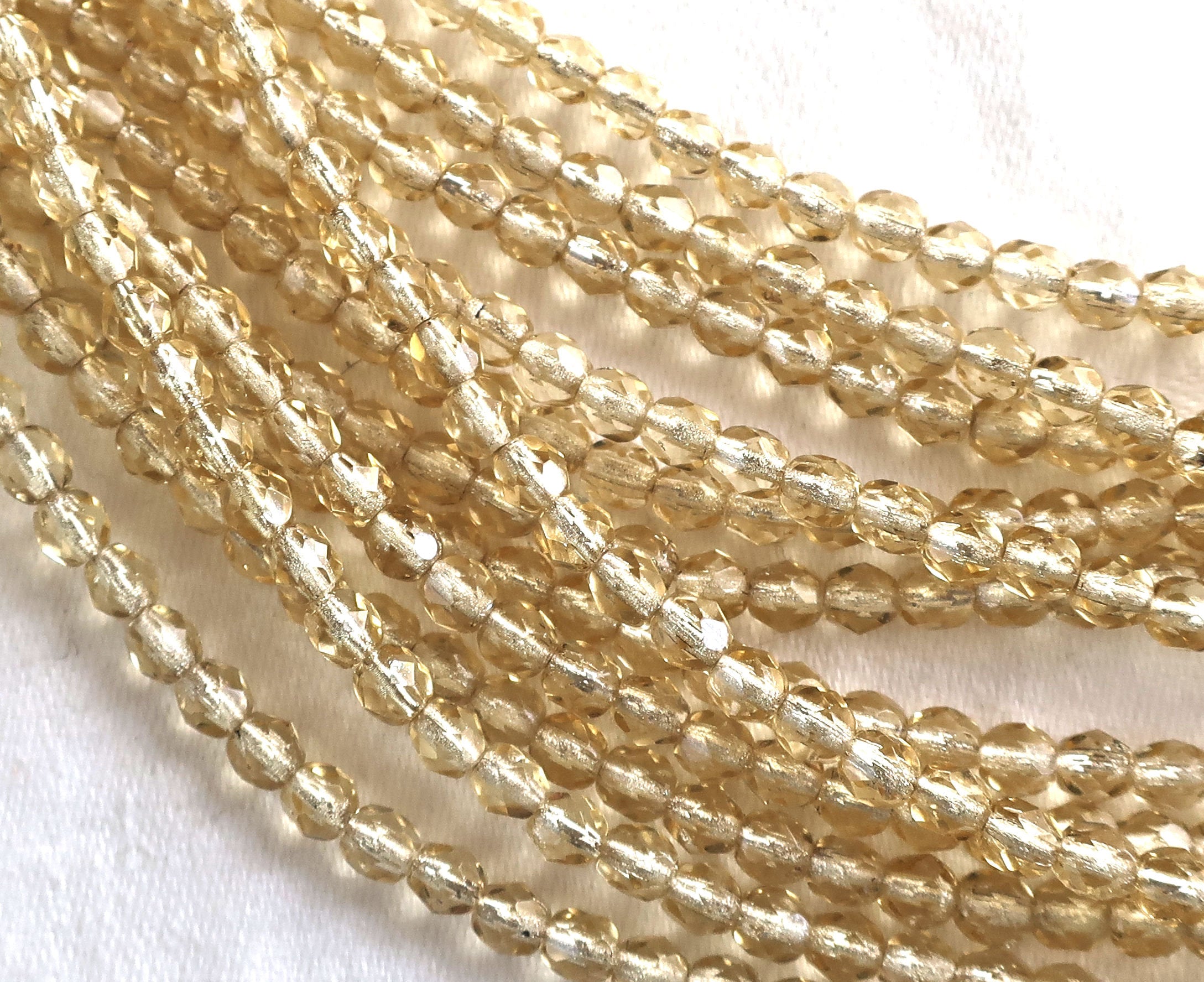 Lot of 50 4mm Light Topaz Czech glass beads, silver lined faceted round firepolished beads C5501 - Glorious Glass Beads