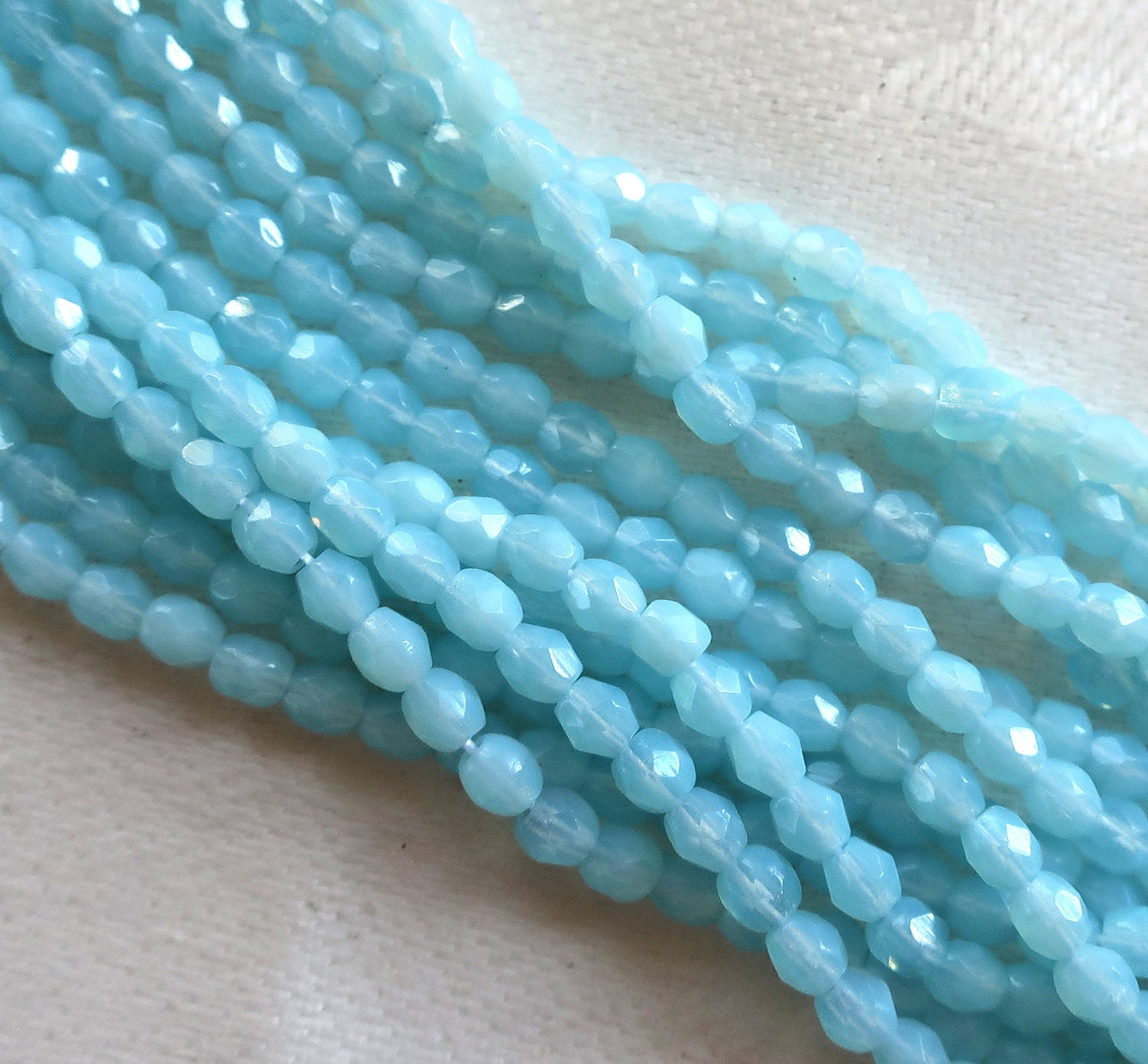 Lot of 50 3mm Milky Baby Blue Czech glass faceted, firepolished, Milky Aquamarine beads C8450 - Glorious Glass Beads