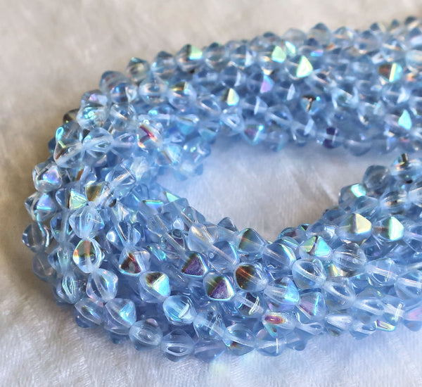 Fifty 6mm Light Sapphire AB bicones, Iridescent blue pressed Czech glass bicone beads C9701 - Glorious Glass Beads