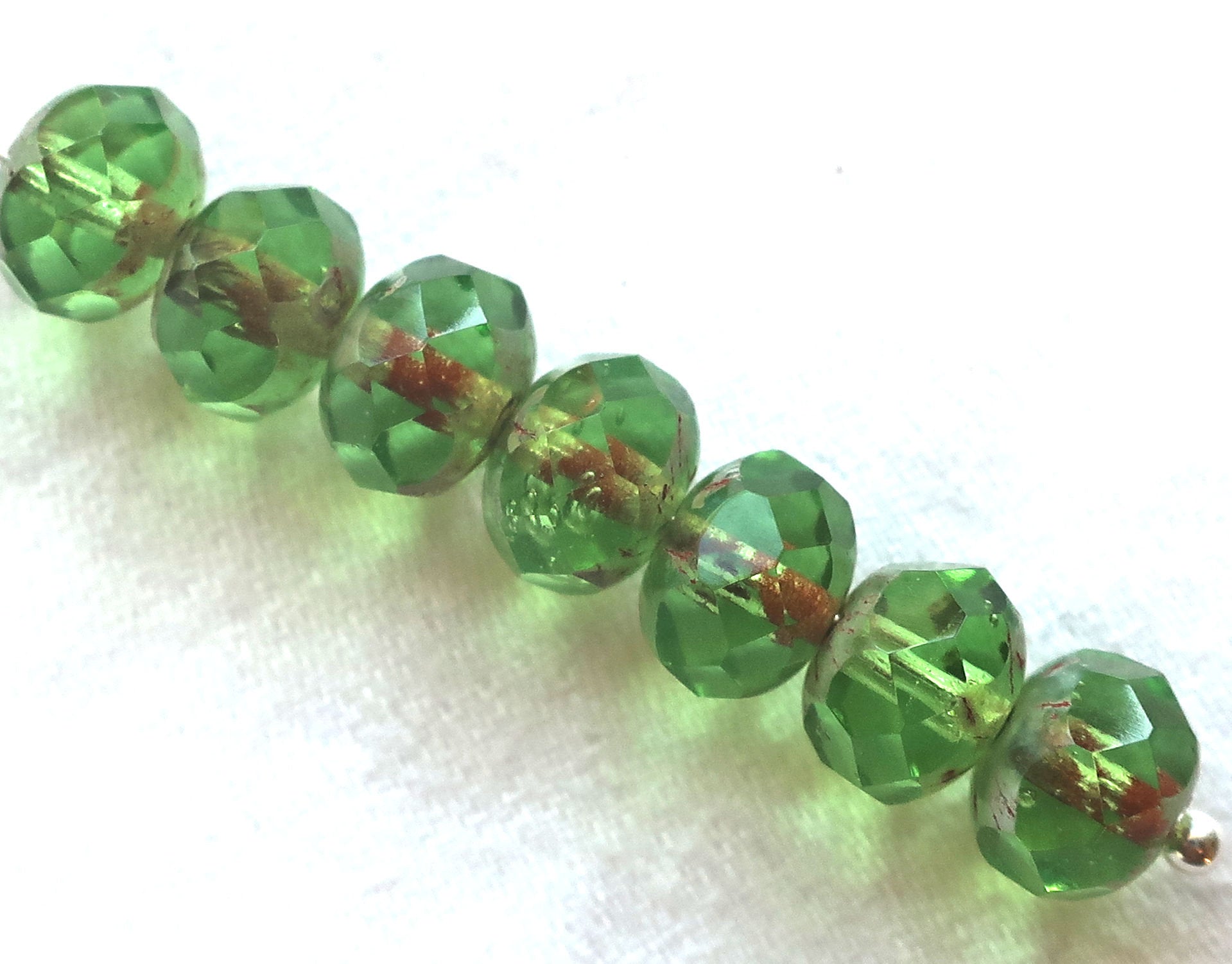 25 faceted Czech glass puffy rondelle beads, 8 x 6mm transparent peridot green picasso rondelles on sale 80101 - Glorious Glass Beads
