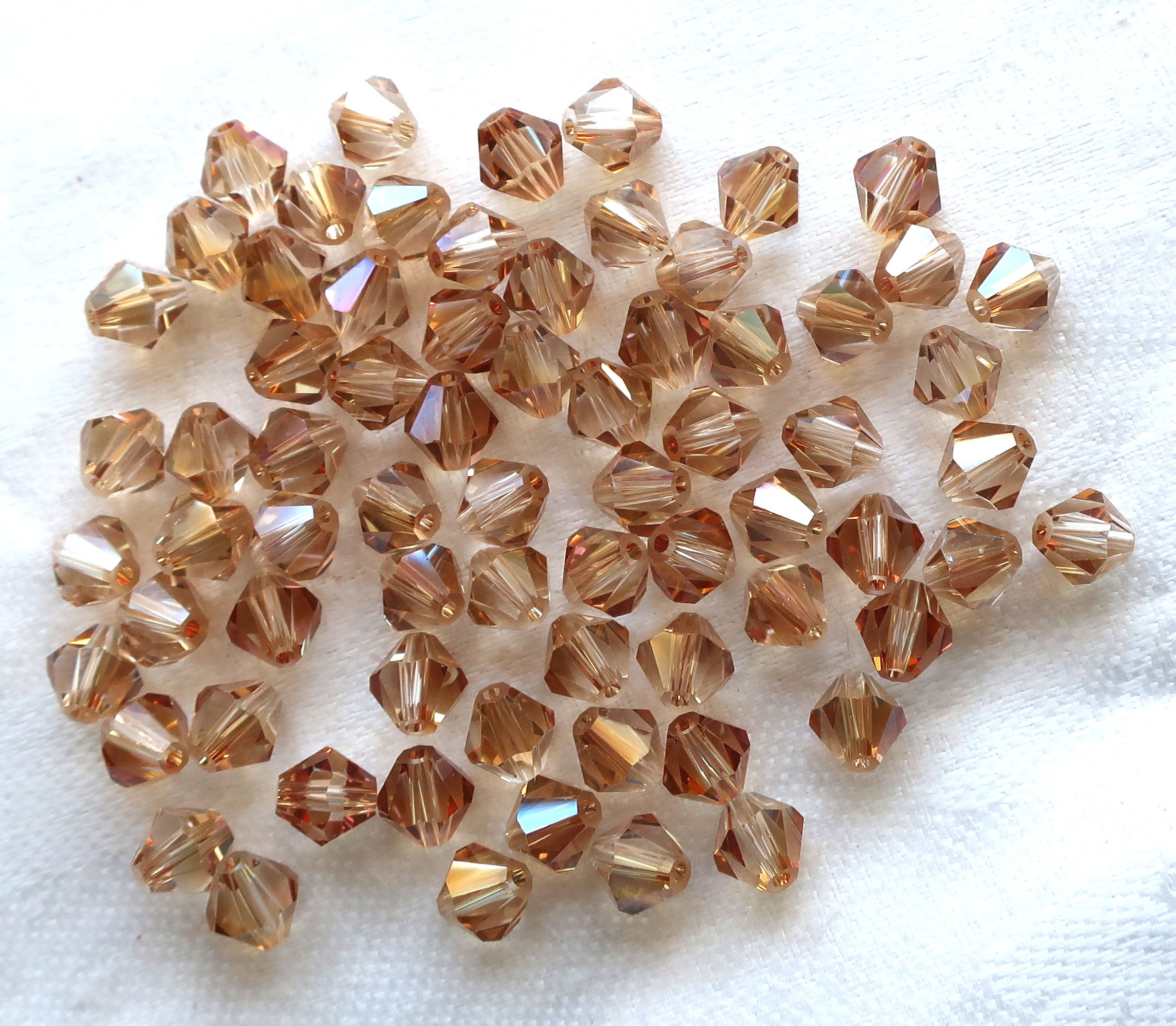 Lot of 24 6mm Celsian Czech Preciosa Crystal bicone beads, faceted golden amber glass bicones C7801