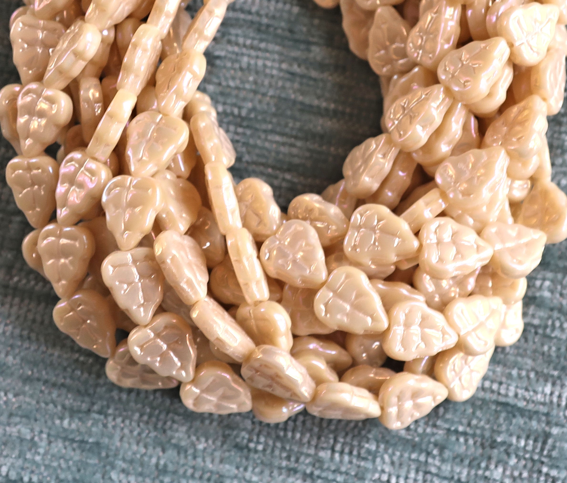 Lot of 25 Czech glass leaf beads, Luster iris opaque off white, champagne, center drilled 8 x 10mm beads 00101 - Glorious Glass Beads