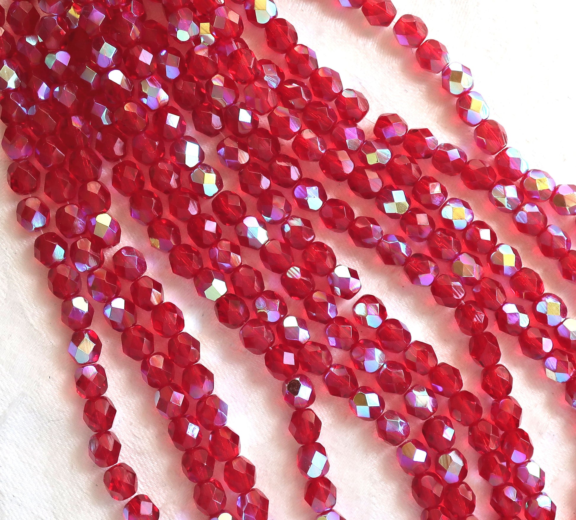 Lot of 25 6mm ruby red AB Czech glass beads, firepolished, faceted round beads, C3525 - Glorious Glass Beads