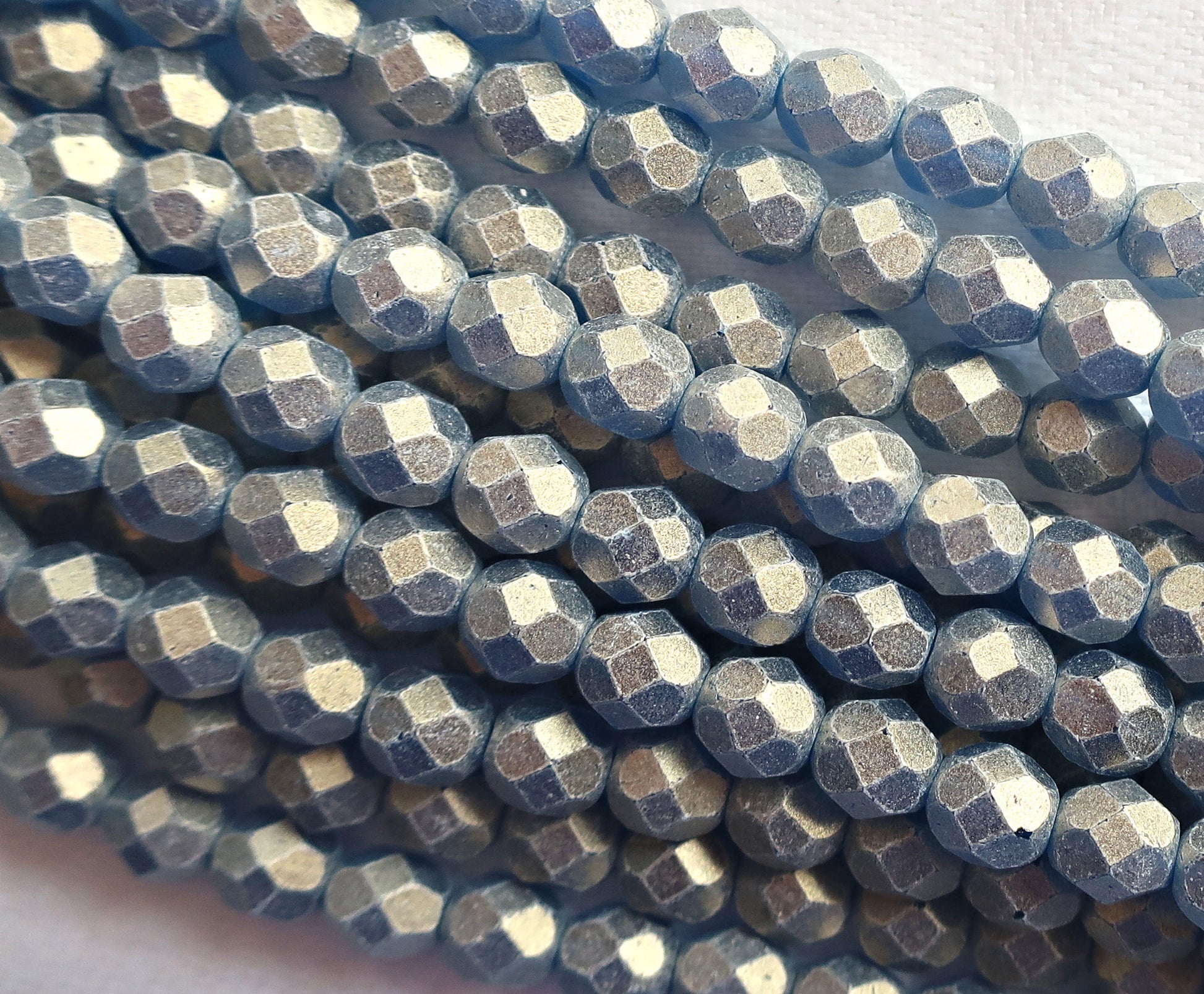 Lot of 25 6mm Sueded Gold Capri Blue Czech glass beads, firepolished, faceted round beads, with a frosty gold finish , C2525 - Glorious Glass Beads