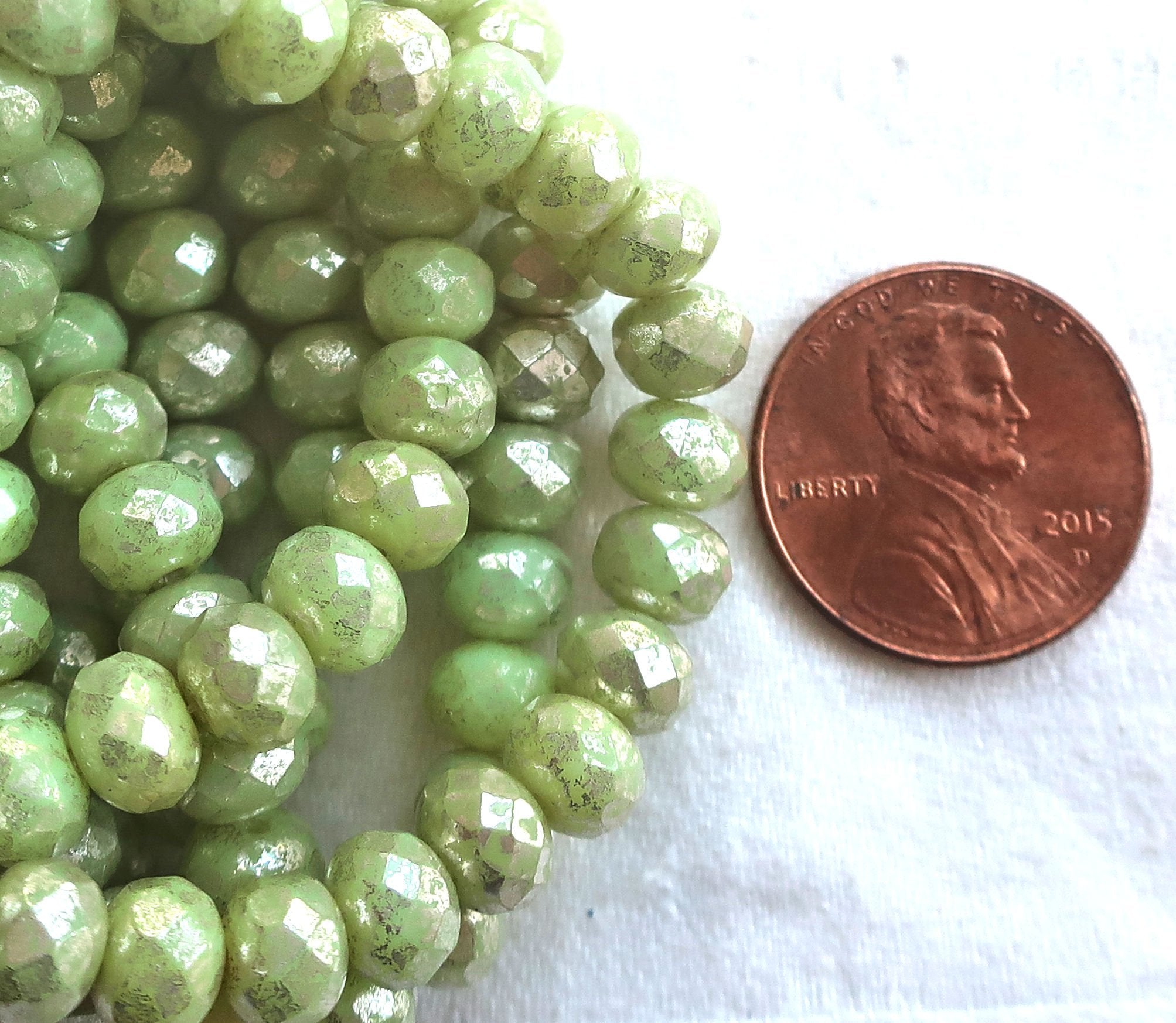 Lot of 25 Czech glass faceted puffy rondelle beads, opaque light honeydew Green with a silver mercury finish, donut beads, 5 x 7mm C00201 - Glorious Glass Beads
