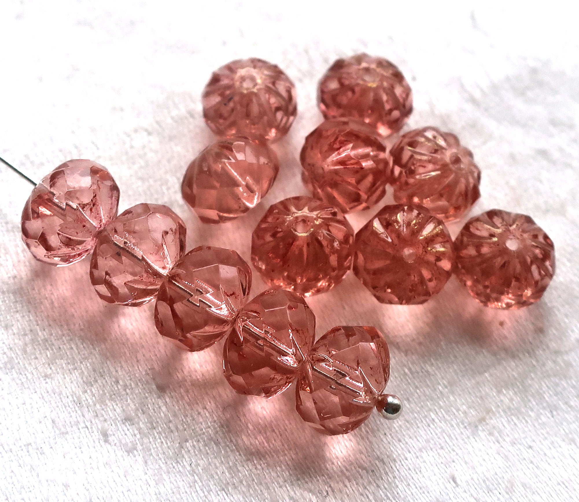 Ten Czech glass faceted, carved cruller beads, 7 x 10mm transparent rosaline pink rondelles, sale price 9801 - Glorious Glass Beads