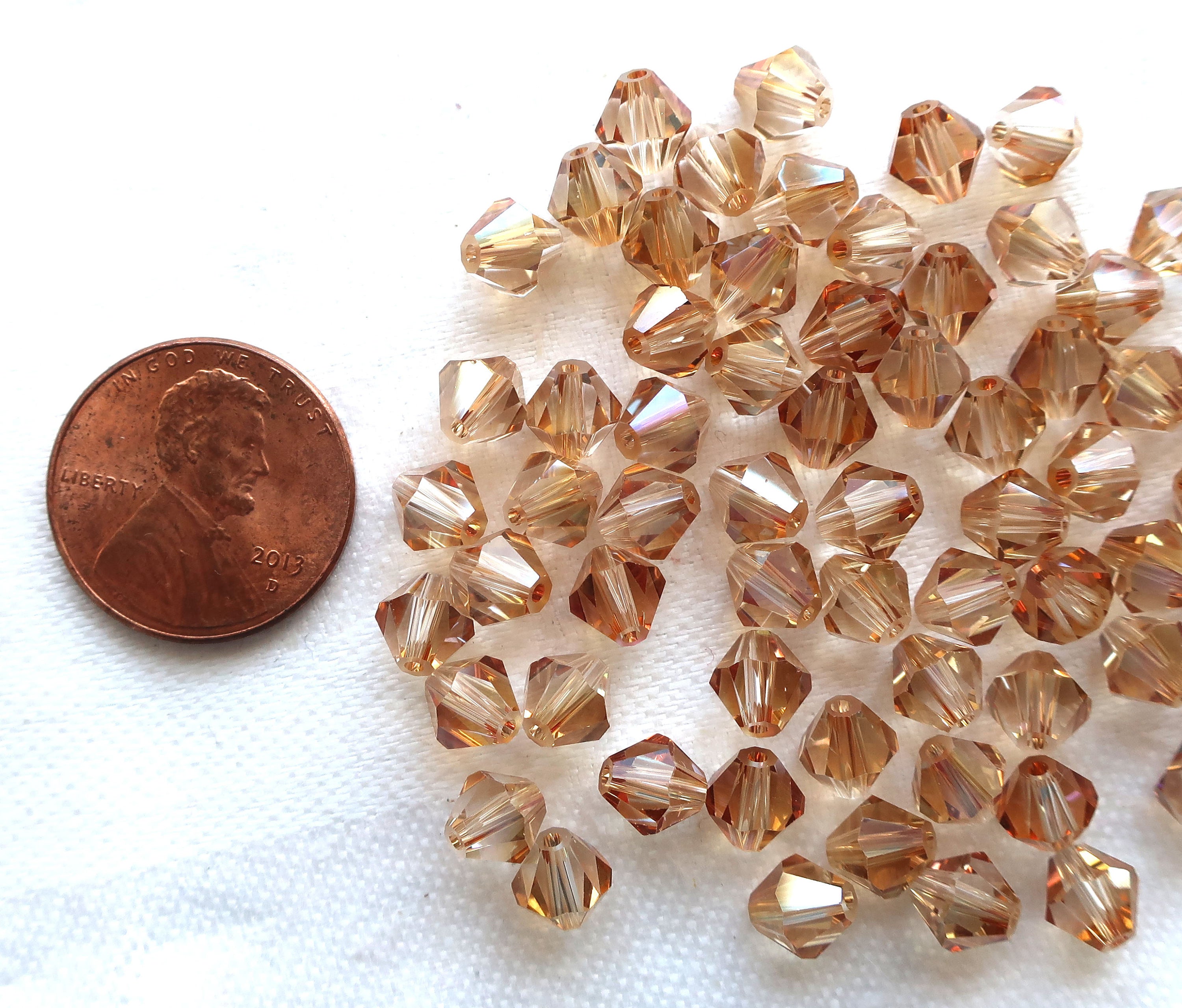 Lot of 24 6mm Celsian Czech Preciosa Crystal bicone beads, faceted golden amber glass bicones C7801