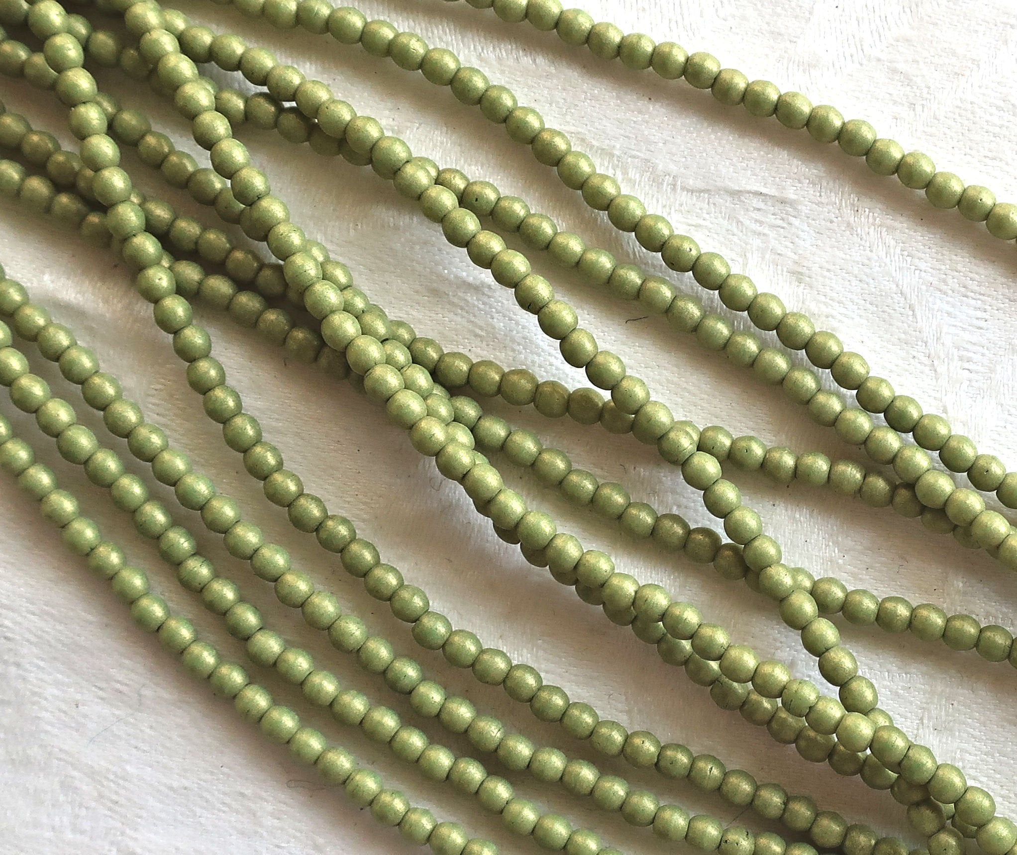 Lot of 100 3mm opaque green Czech glass druks, Pacifica Avocado smooth round druk beads C8901 - Glorious Glass Beads