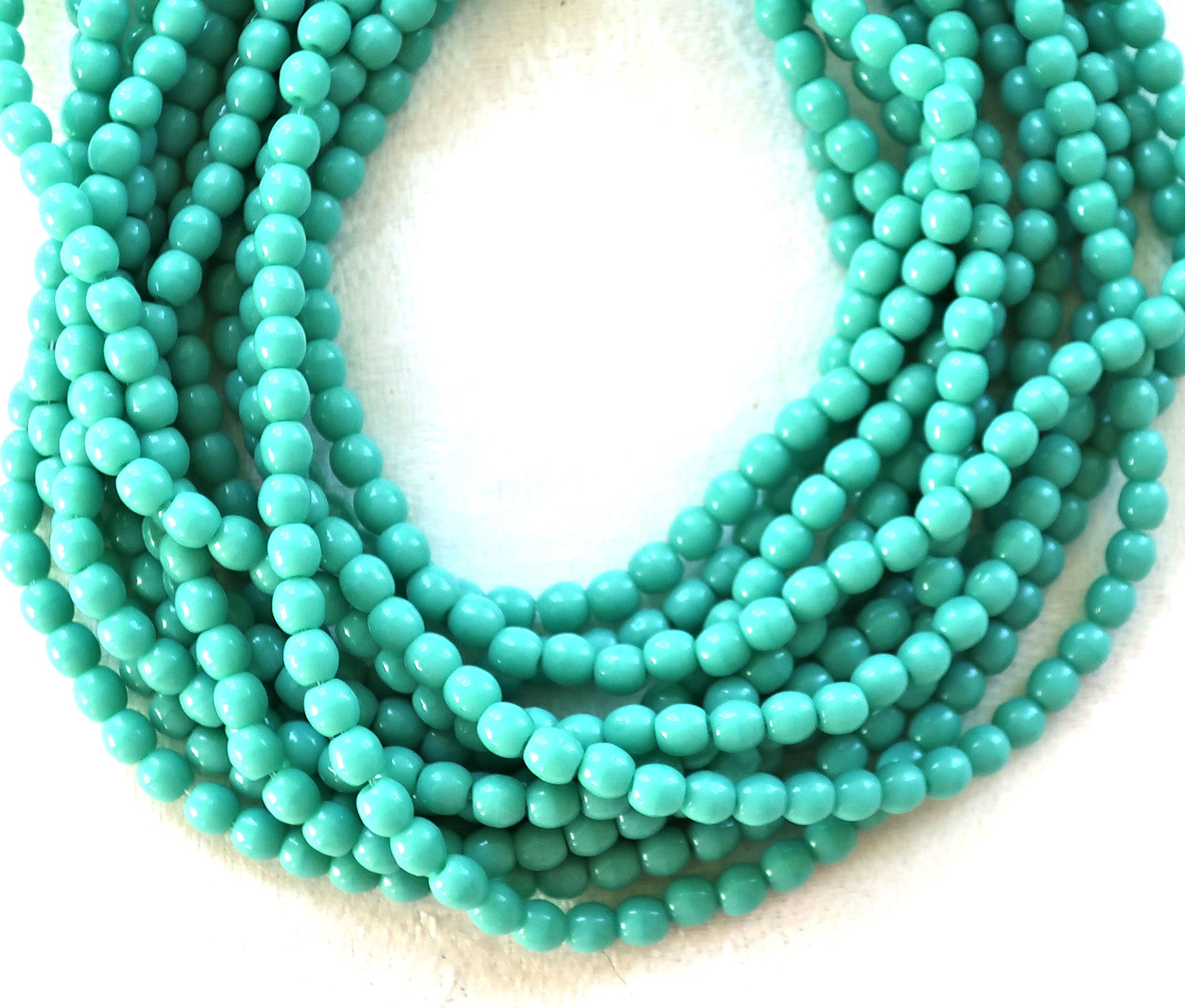 Lot of 100 3mm turquoise blue green Czech glass druks, smooth round druk beads C6601 - Glorious Glass Beads