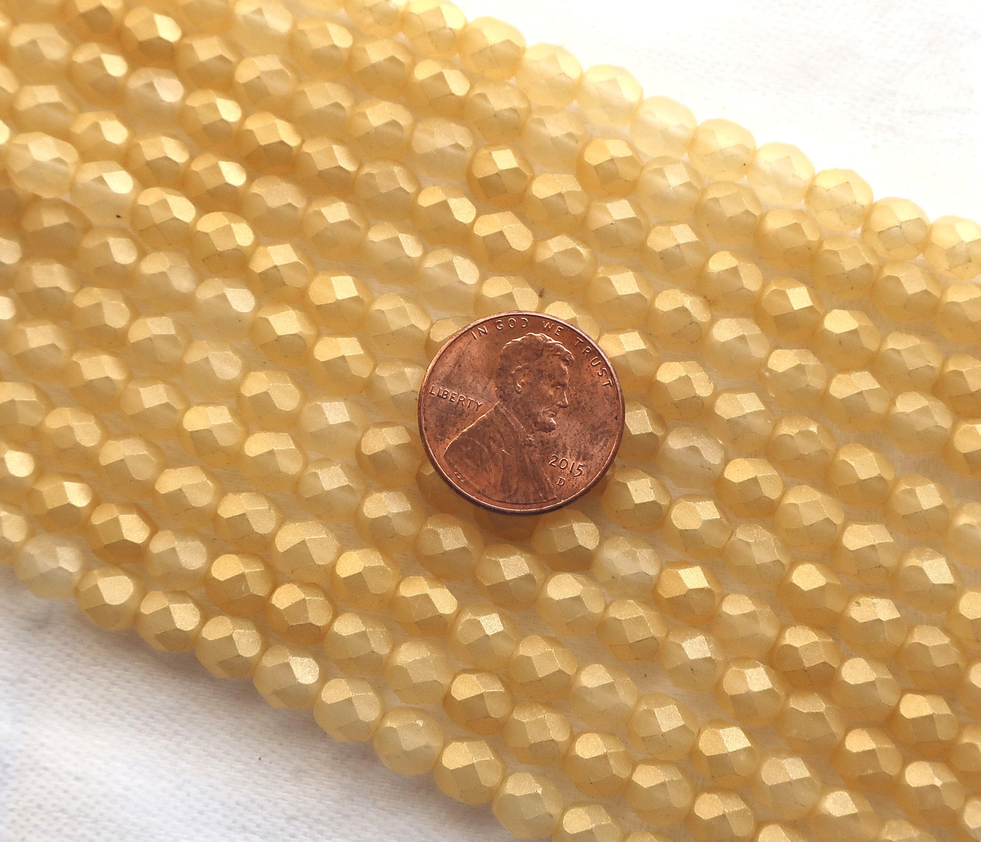 Lot of 25 6mm Sueded Gold Lame, Amber faceted round firepolished glass beads with a frosted gold finish C6425 - Glorious Glass Beads