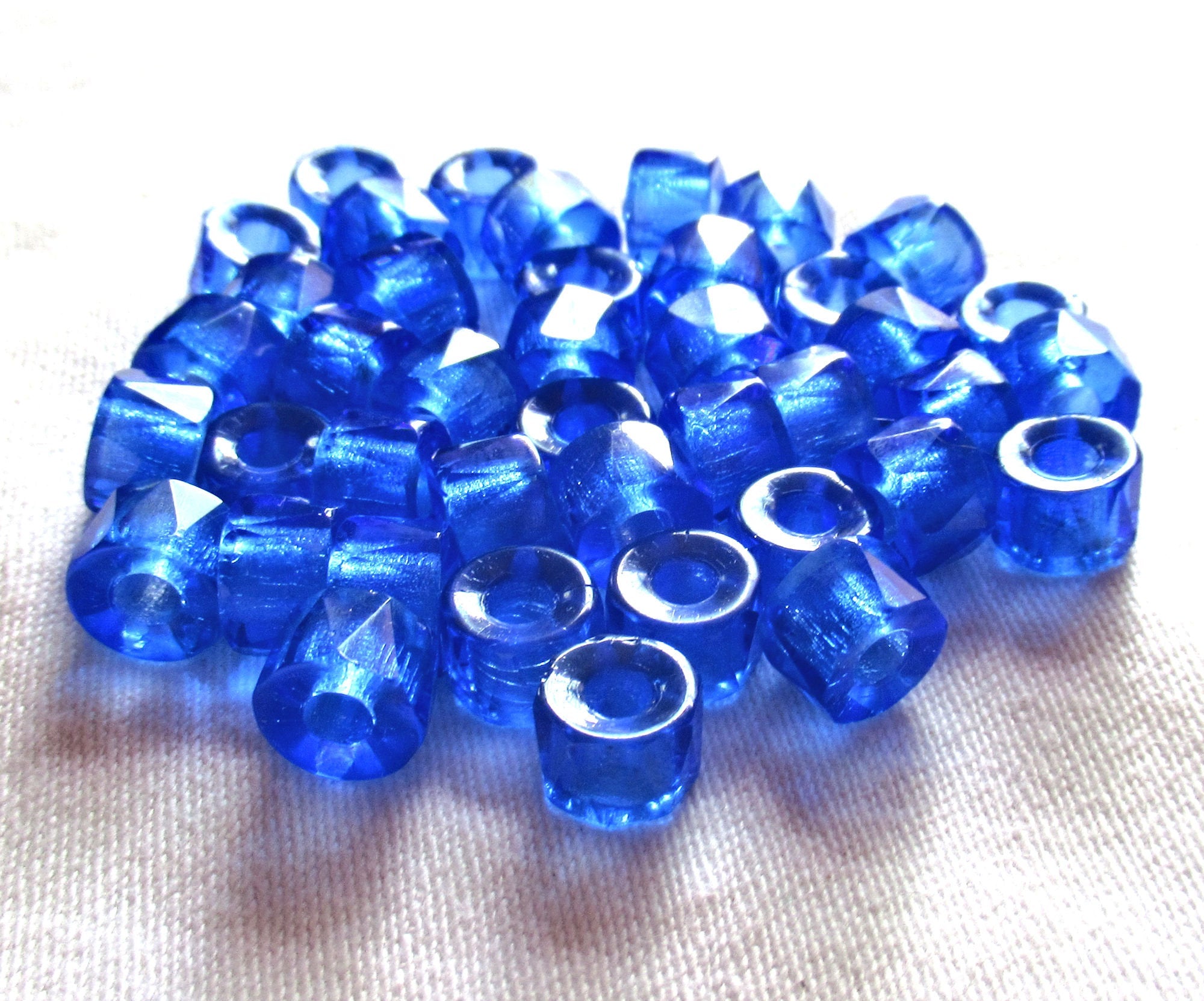 Lot of 25 9mm faceted Czech glass pony or roller beads - transparent sapphire blue large hole beads