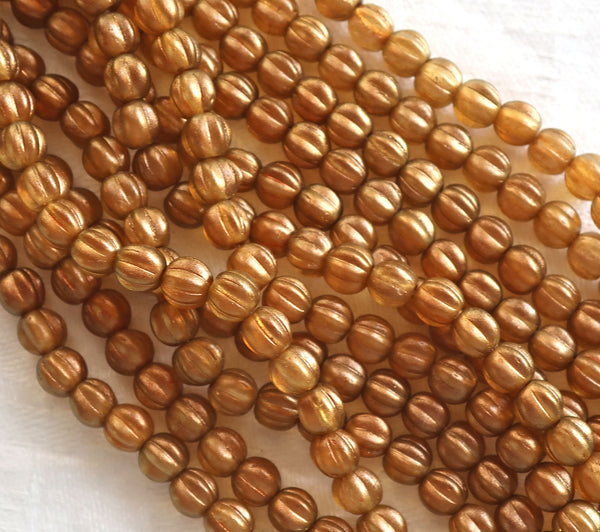 Lot of 50 5mm Czech glass melon beads, Halo Sandalwood, orange, sienna or burnt umber with a golden glow C51150