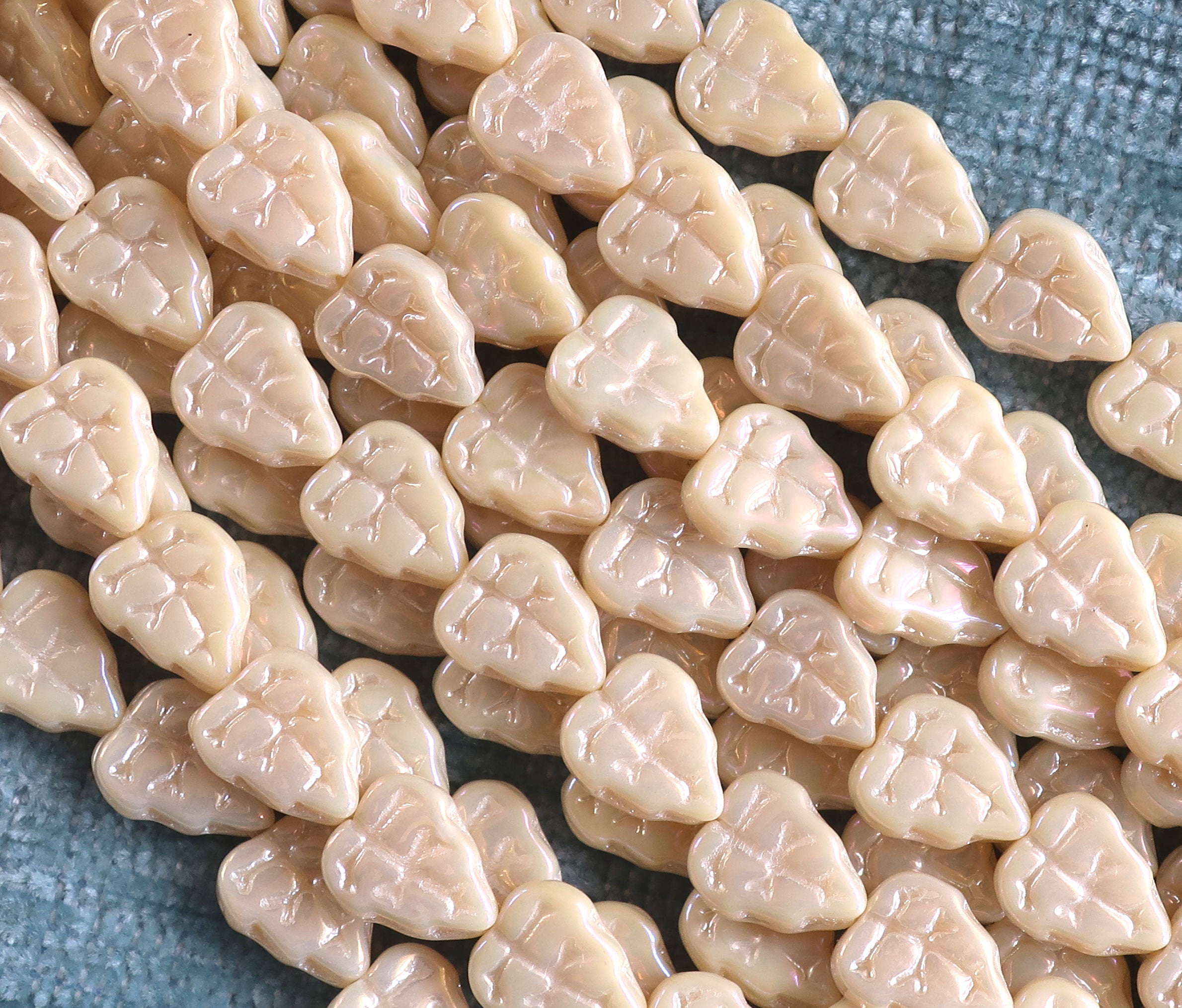 Lot of 25 Czech glass leaf beads, Luster iris opaque off white, champagne, center drilled 8 x 10mm beads 00101 - Glorious Glass Beads