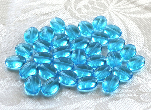 25 transparent Aqua Blue flat oval Czech Glass beads, 12mm x 9mm pressed glass beads C7425 - Glorious Glass Beads