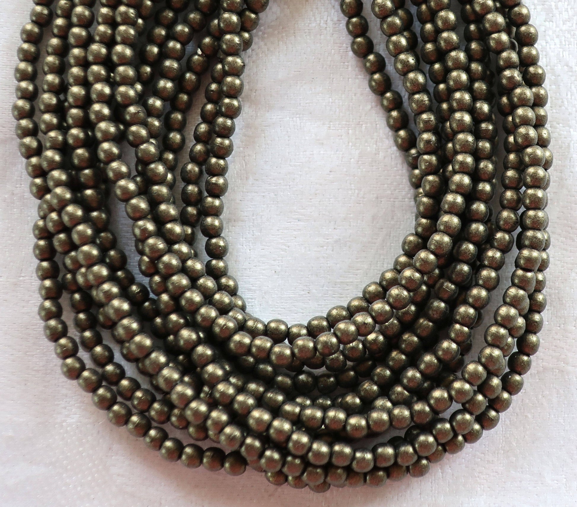 Lot of 100 3mm metallic suede gold Czech glass druks, smooth round druk beads C8501 - Glorious Glass Beads