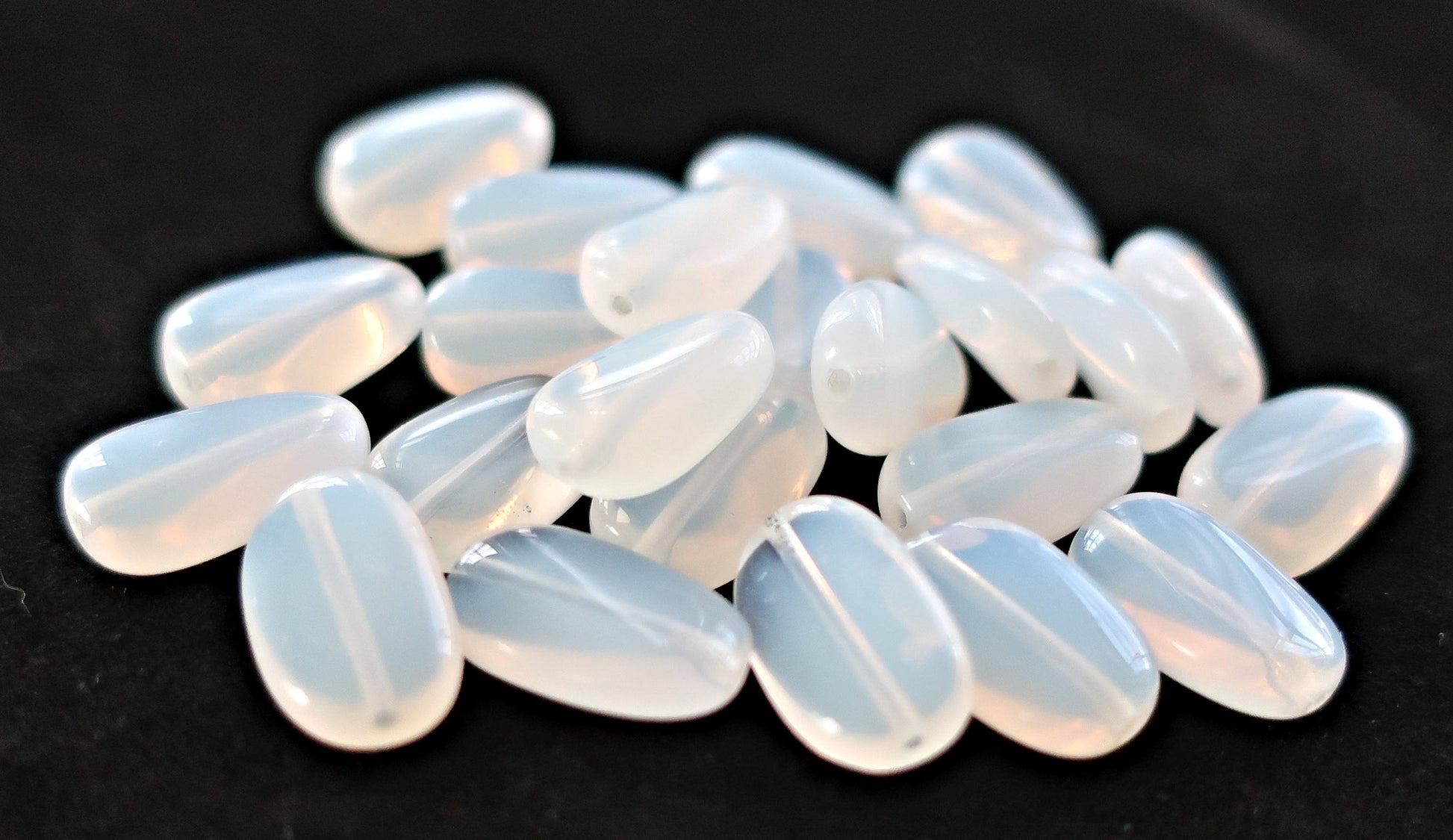 Lot of 25 translucent milky white slightly twisted oval Czech Glass beads, 14mm x 8mm pressed glass beads C0625 - Glorious Glass Beads