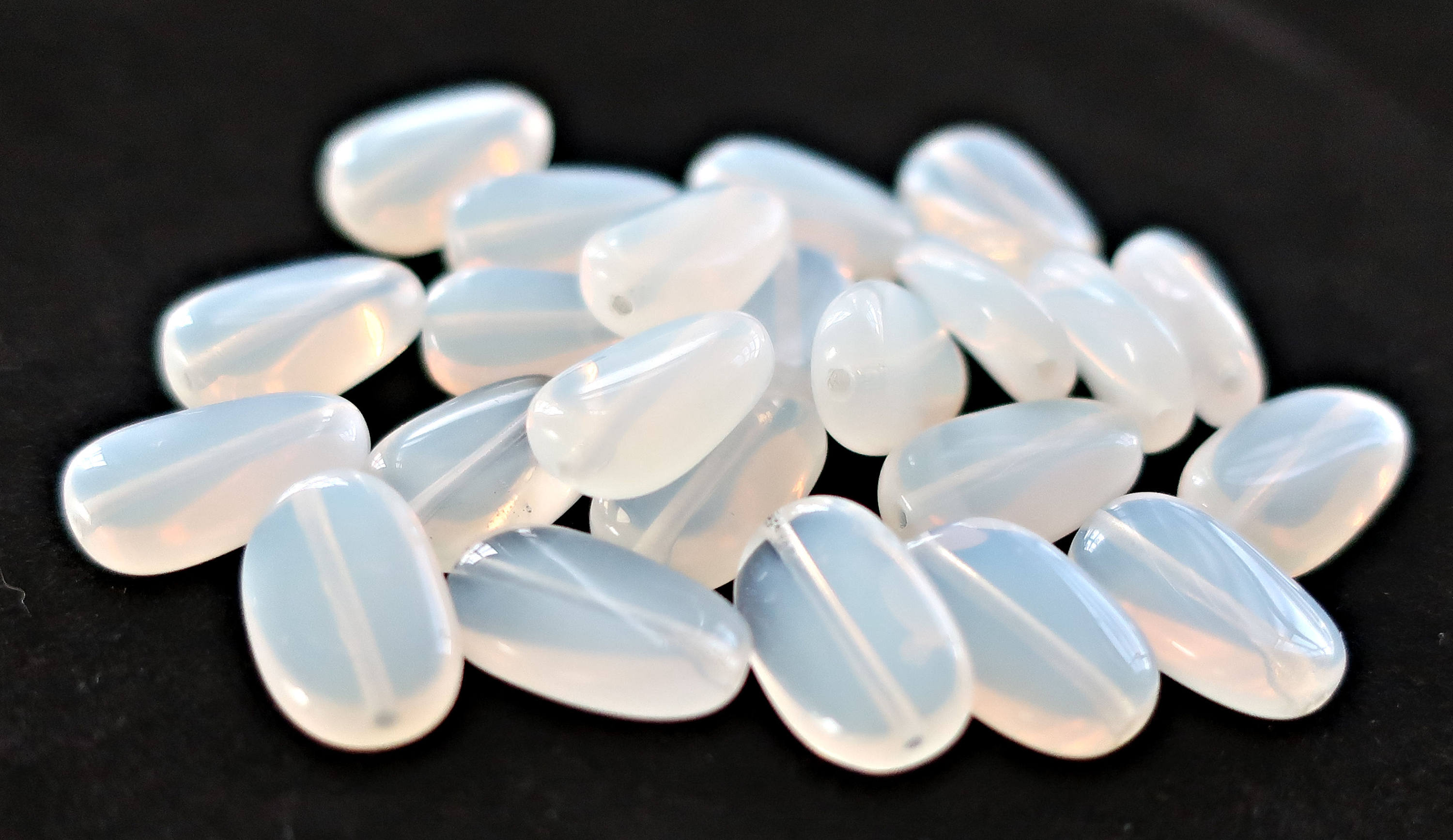 Lot of 25 translucent milky white slightly twisted oval Czech Glass beads, 14mm x 8mm pressed glass beads C0625 - Glorious Glass Beads