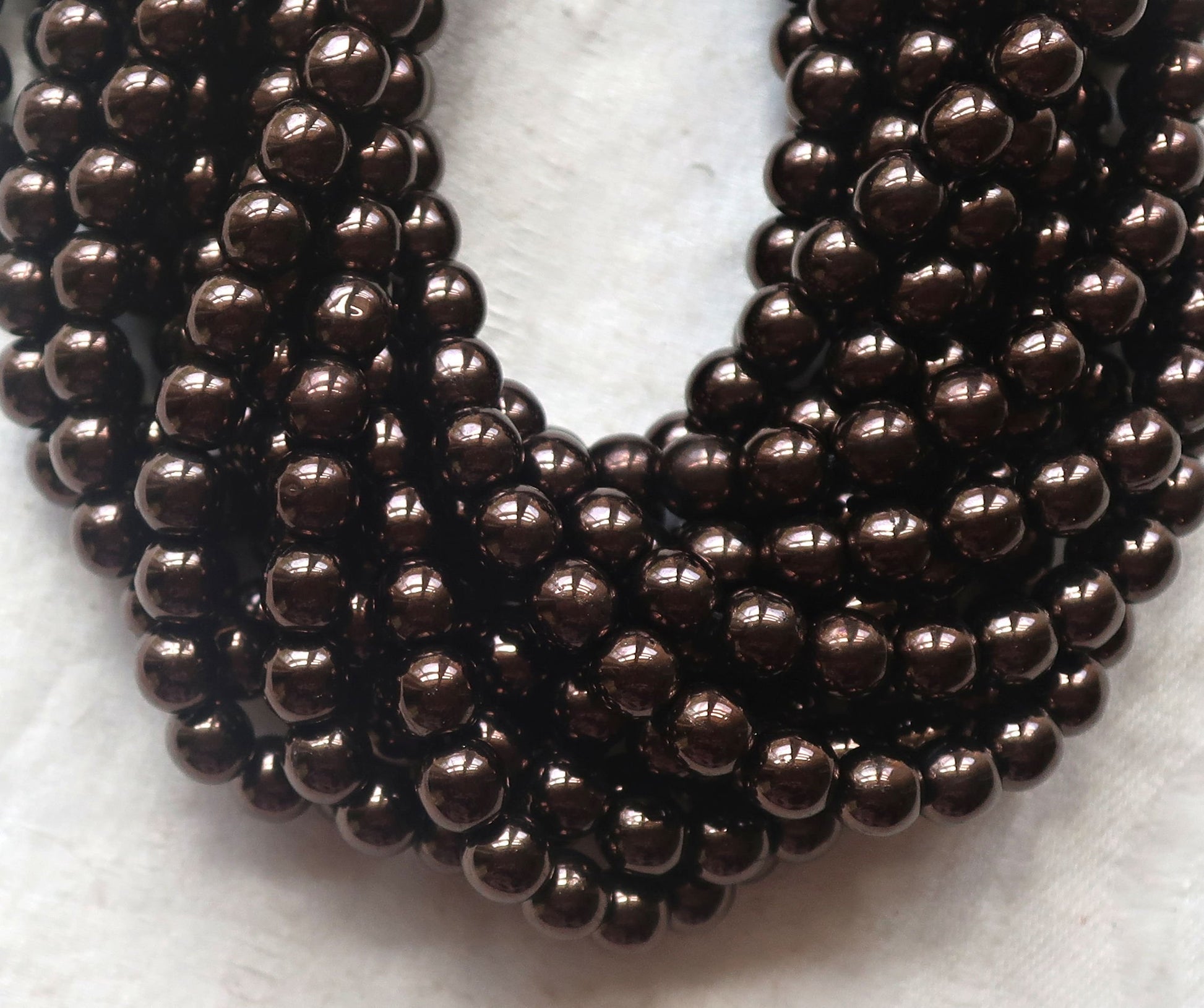 Lot of fifty 6mm Czech glass druks, Metallic Dark Chocolate Bronze smooth round Czech glass druk beads C92101 - Glorious Glass Beads