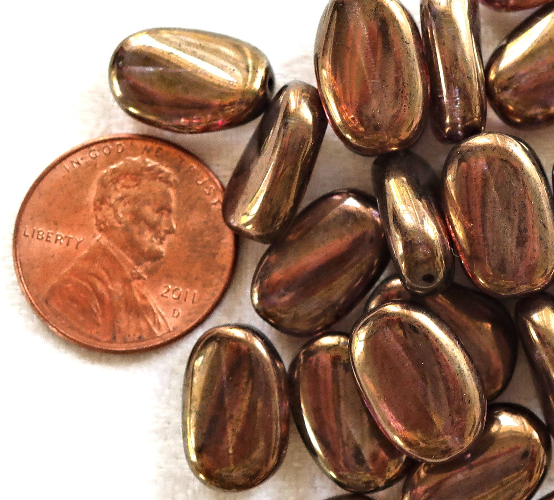 Lot of 25 Lumi Brown slightly twisted oval Czech Glass beads, 14mm x 8mm pressed glass beads C36125 - Glorious Glass Beads