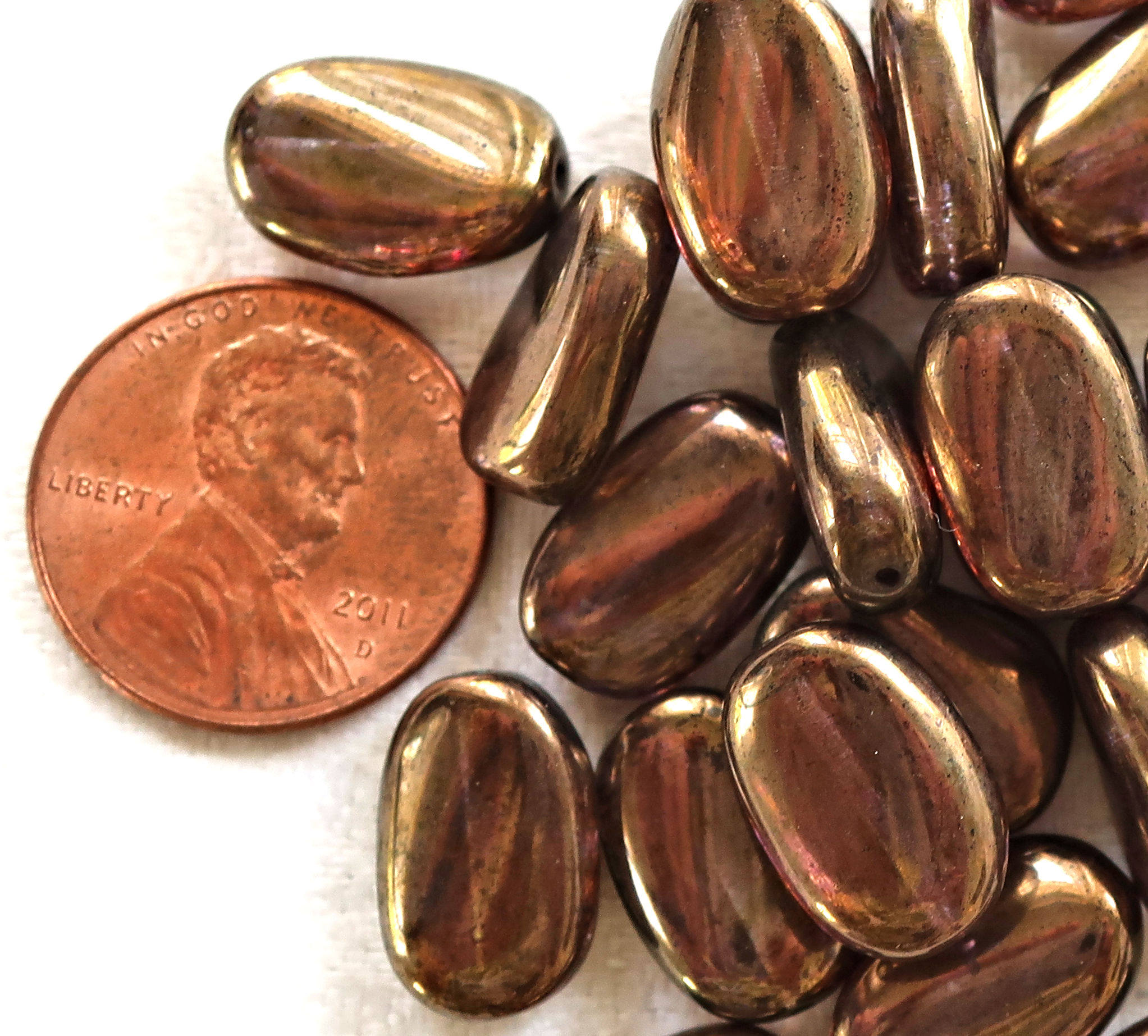 Lot of 25 Lumi Brown slightly twisted oval Czech Glass beads, 14mm x 8mm pressed glass beads C36125 - Glorious Glass Beads