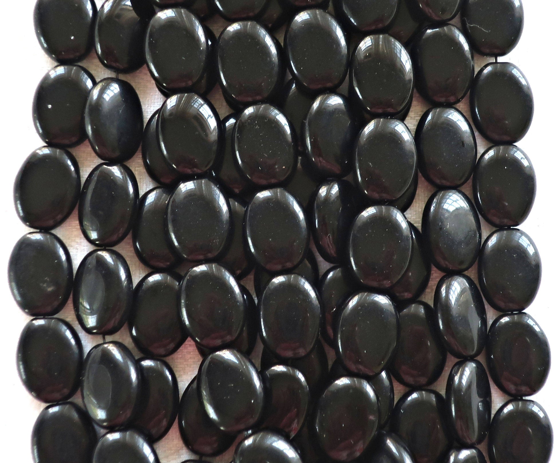 25 Black flat oval Czech Glass beads, 12mm x 9mm pressed glass beads C0425 - Glorious Glass Beads