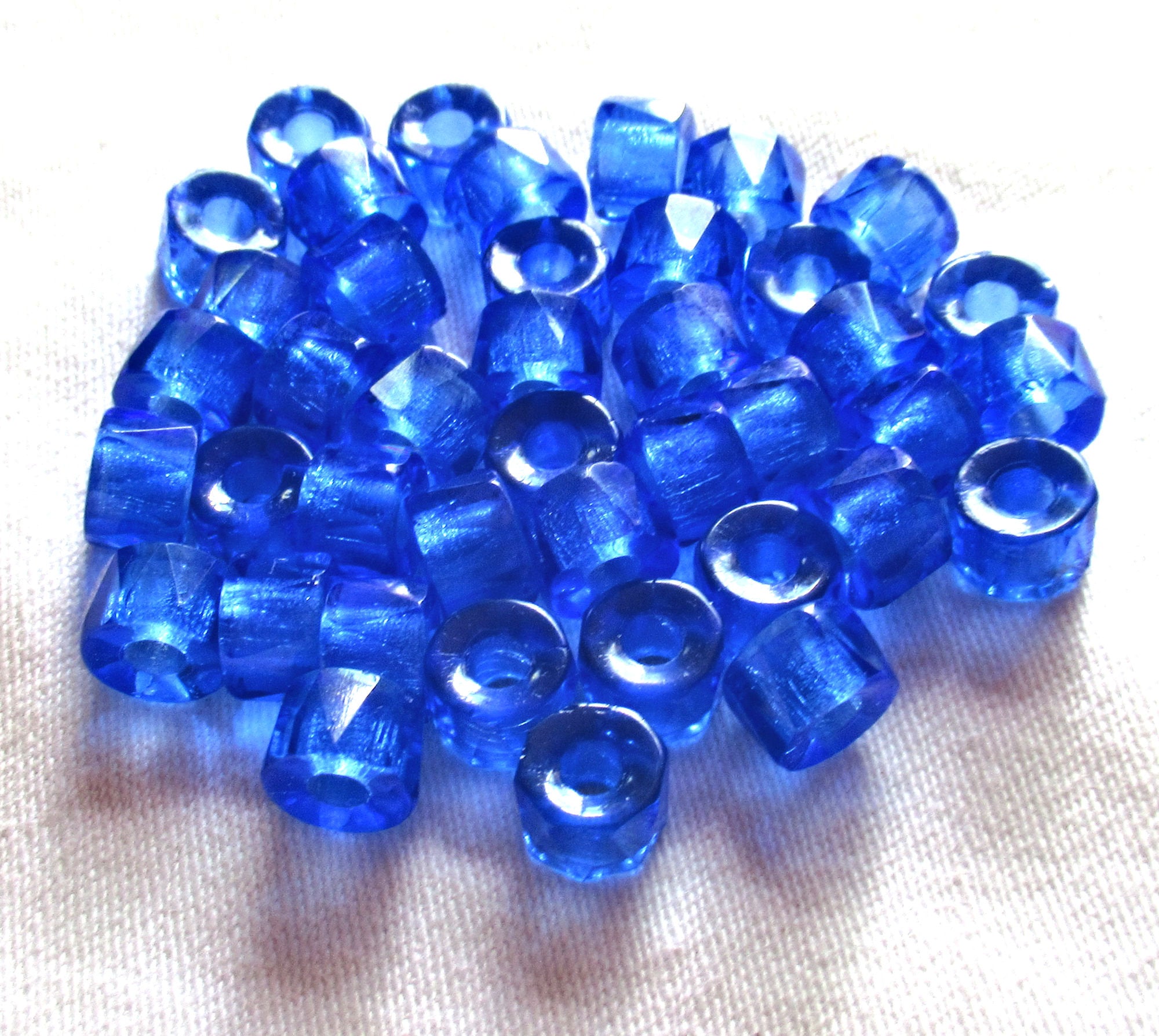 Lot of 25 9mm faceted Czech glass pony or roller beads - transparent sapphire blue large hole beads