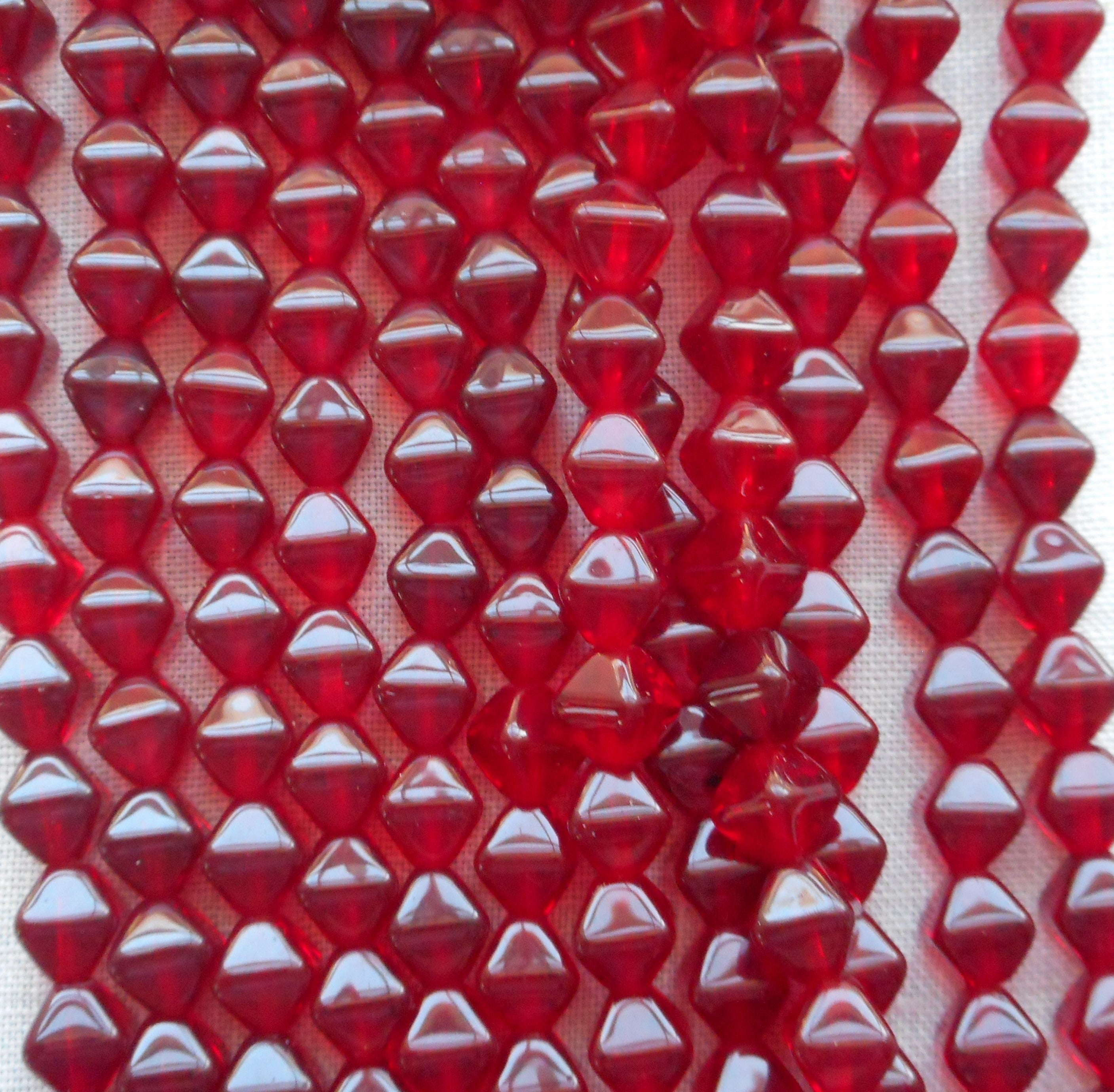 Fifty 6mm dark ruby red, garnet bicones, pressed glass Czech beads, C0082