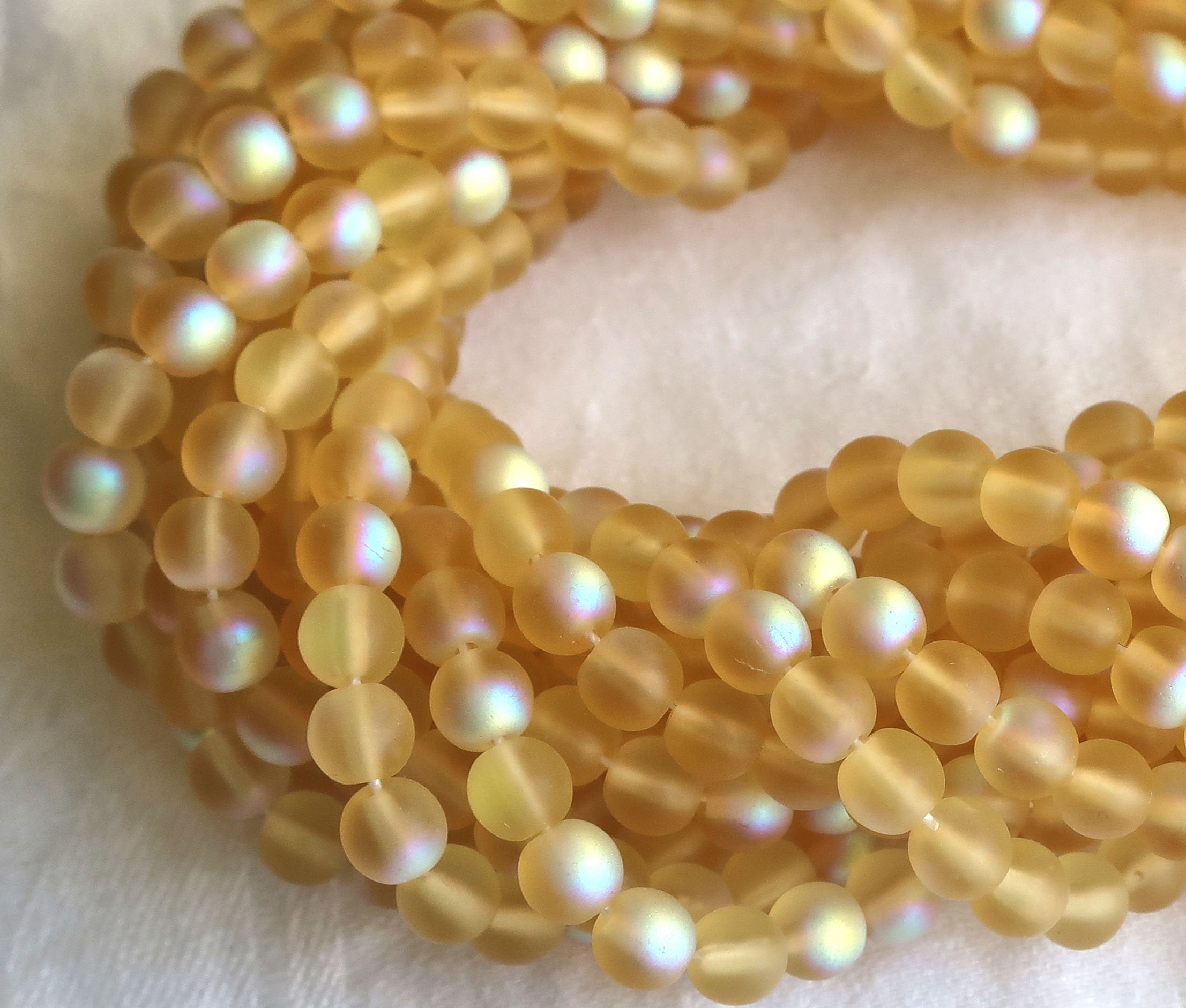 Lot of 50 6mm Czech glass druks, matte light topaz AB, Amber, smooth round druk beads C1750 - Glorious Glass Beads