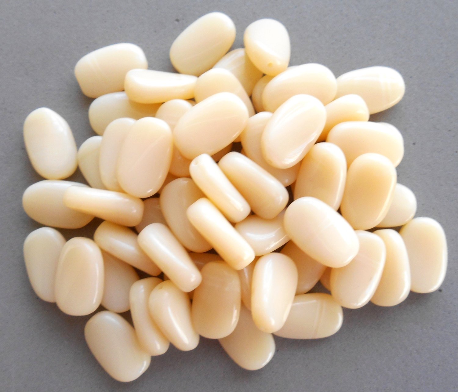 25 Off White, Cream slightly twisted oval Czech Glass beads, 14mm x 8mm pressed glass beads C3625 - Glorious Glass Beads