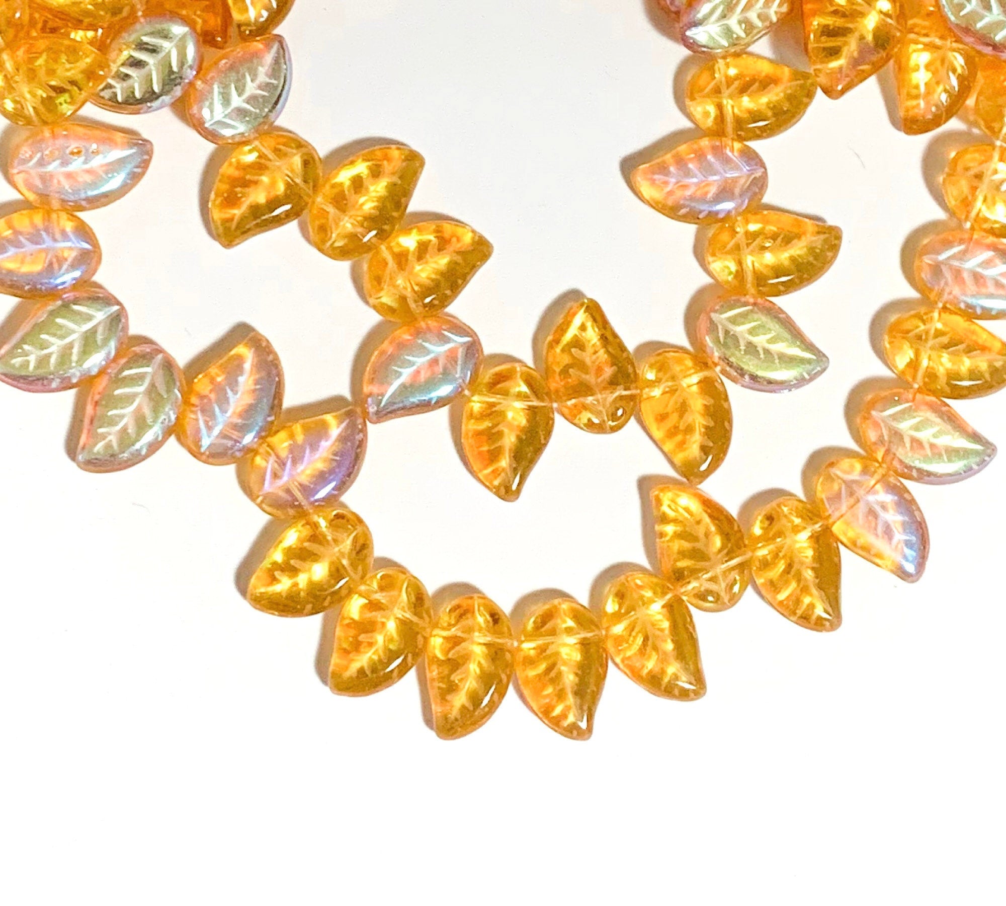 25 Czech glass side drilled eucalyptus leaf beads - 12 x 9mm topaz AB leaves - textured pressed glass beads - C0077