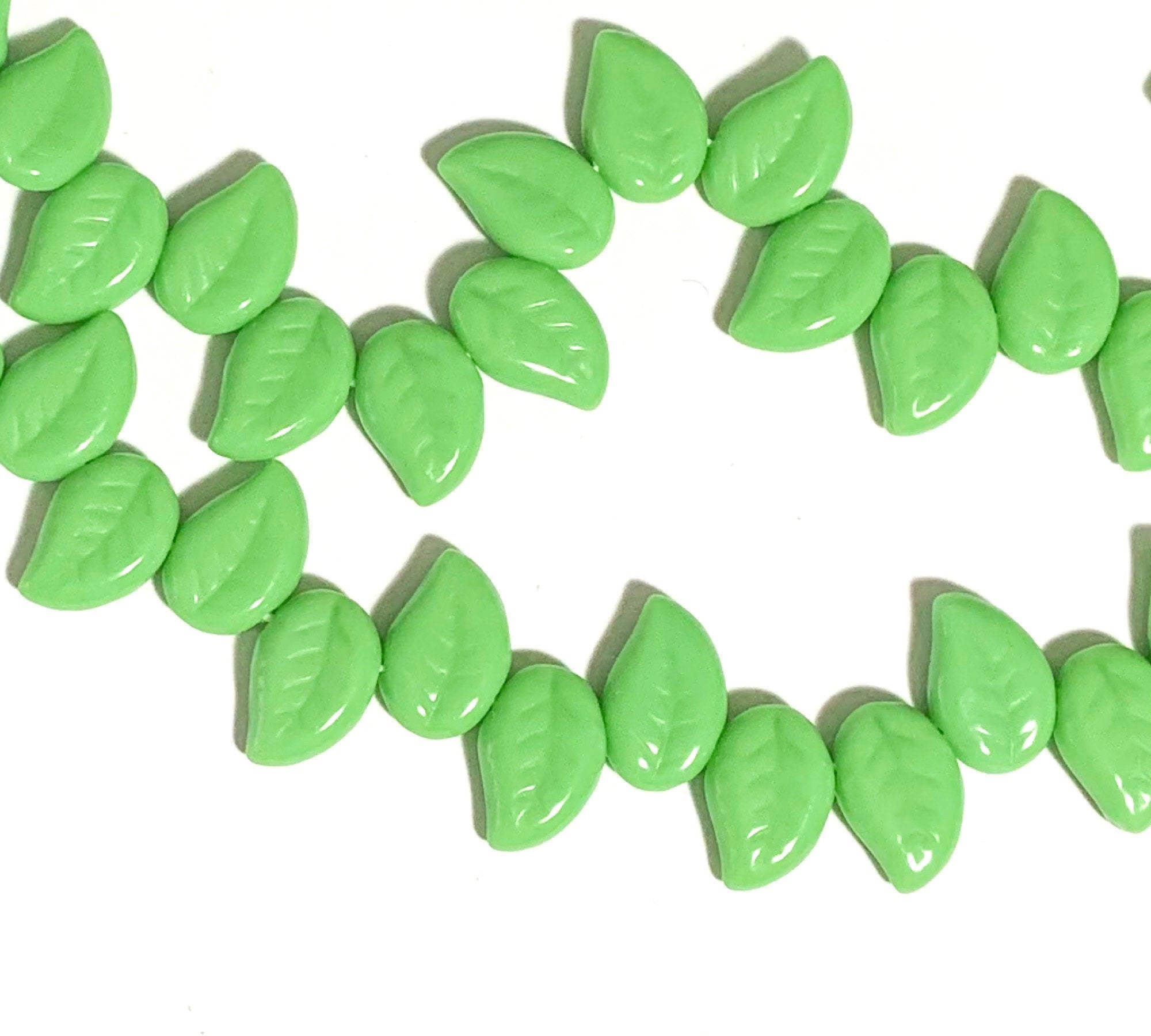 25 Czech glass side drilled eucalyptus leaf beads - 12 x 9mm opaque green leaves - textured pressed glass beads - C0077