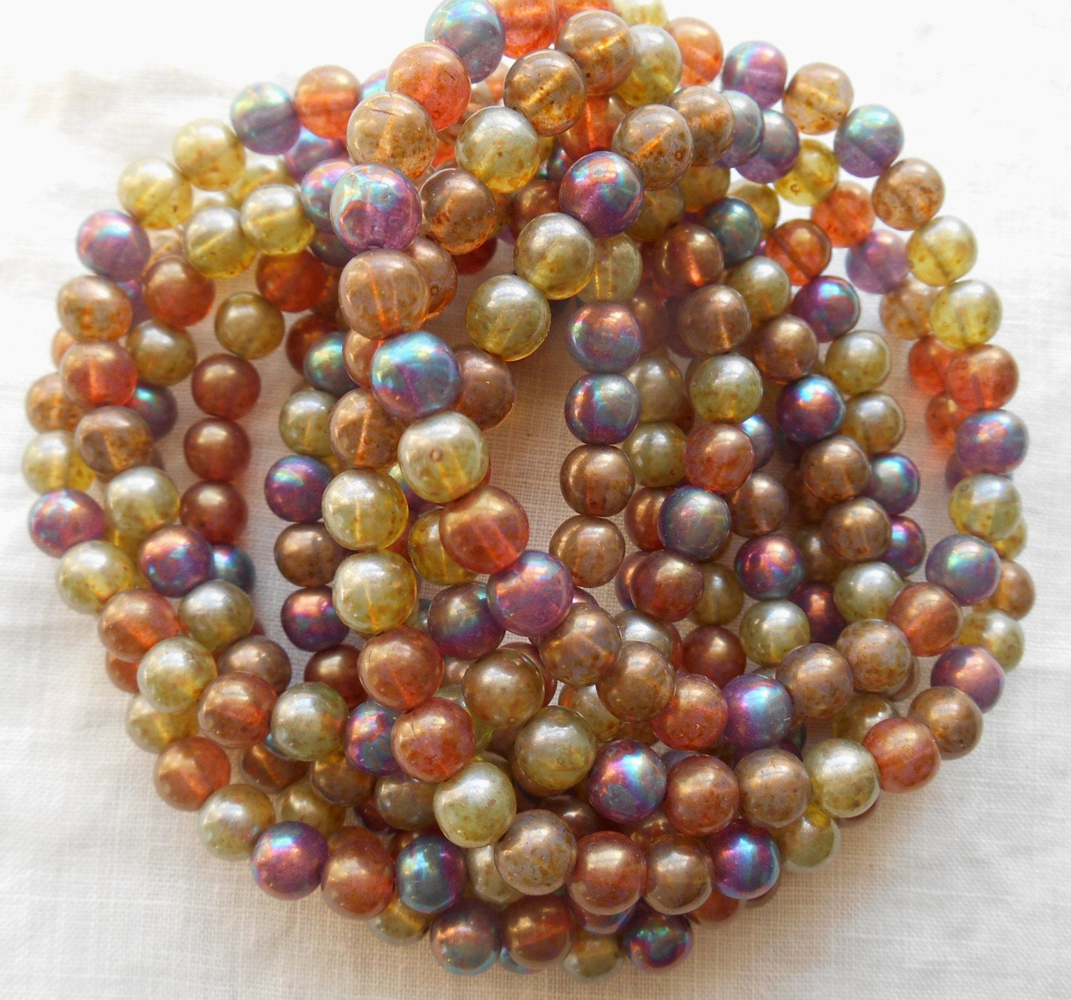 30 6mm Czech glass beads, earth tones mix, yellow, umber, purple, green etc. smooth round druk beads with an iridescent luster finish C2901