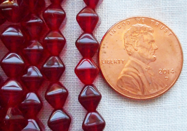 Fifty 6mm dark ruby red, garnet bicones, pressed glass Czech beads, C0082