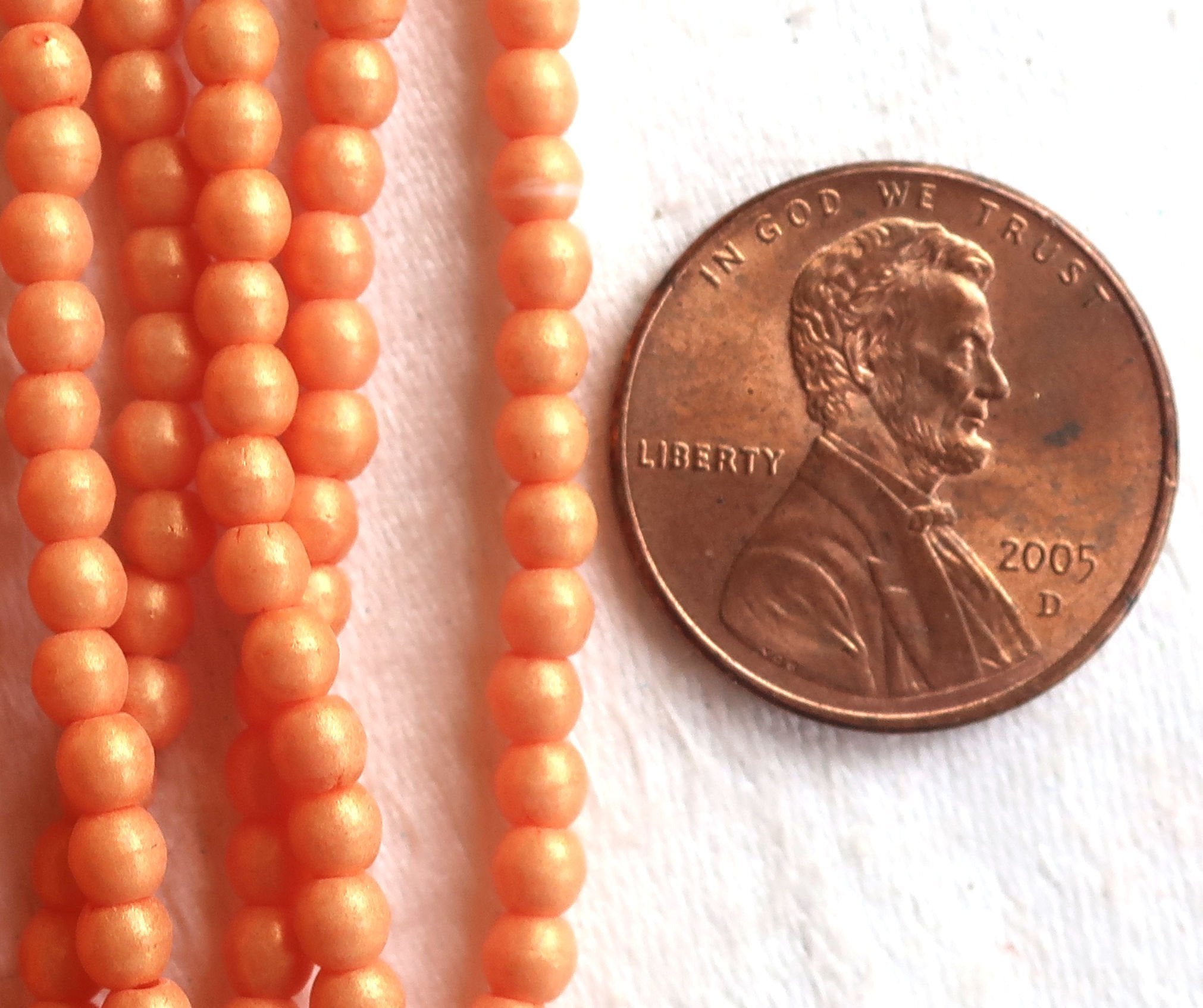 Lot of 100 3mm Czech glass druks; Pacifica Tangerine, opaque creamy orange pressed glass, smooth, round druk beads C7701 - Glorious Glass Beads