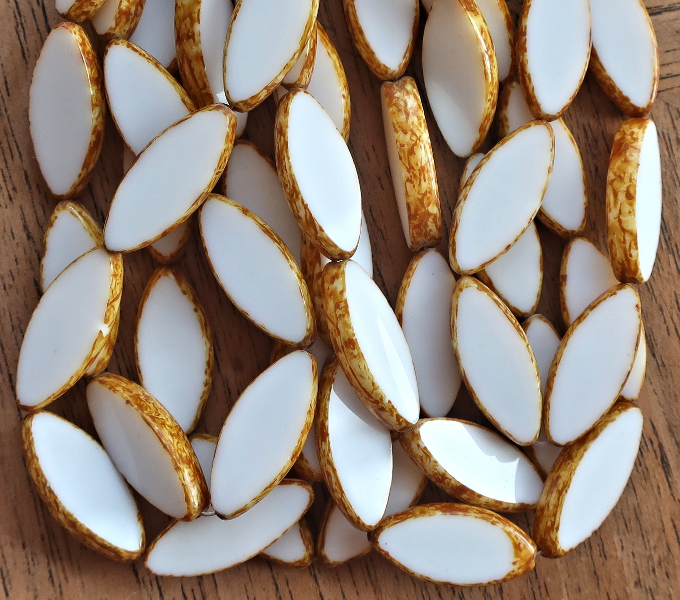 Ten opaque chalk white picasso spindle beads - 7 x 18mm - table cut almond shaped Czech glass tube beads 50201 - Glorious Glass Beads