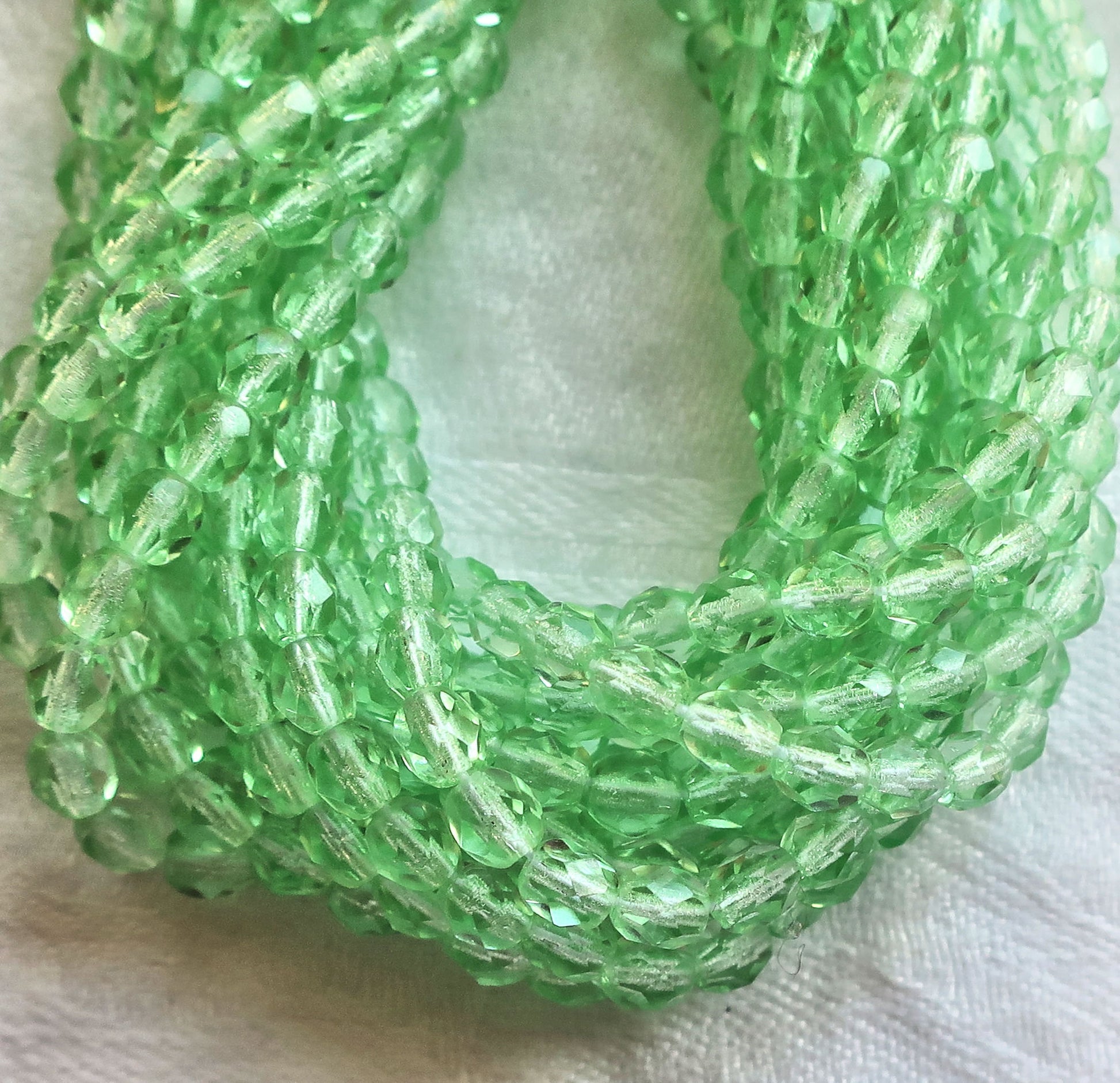 Lot of 50 4mm Peridot, light green Czech glass beads, firepolished faceted round glass beads C2501 - Glorious Glass Beads